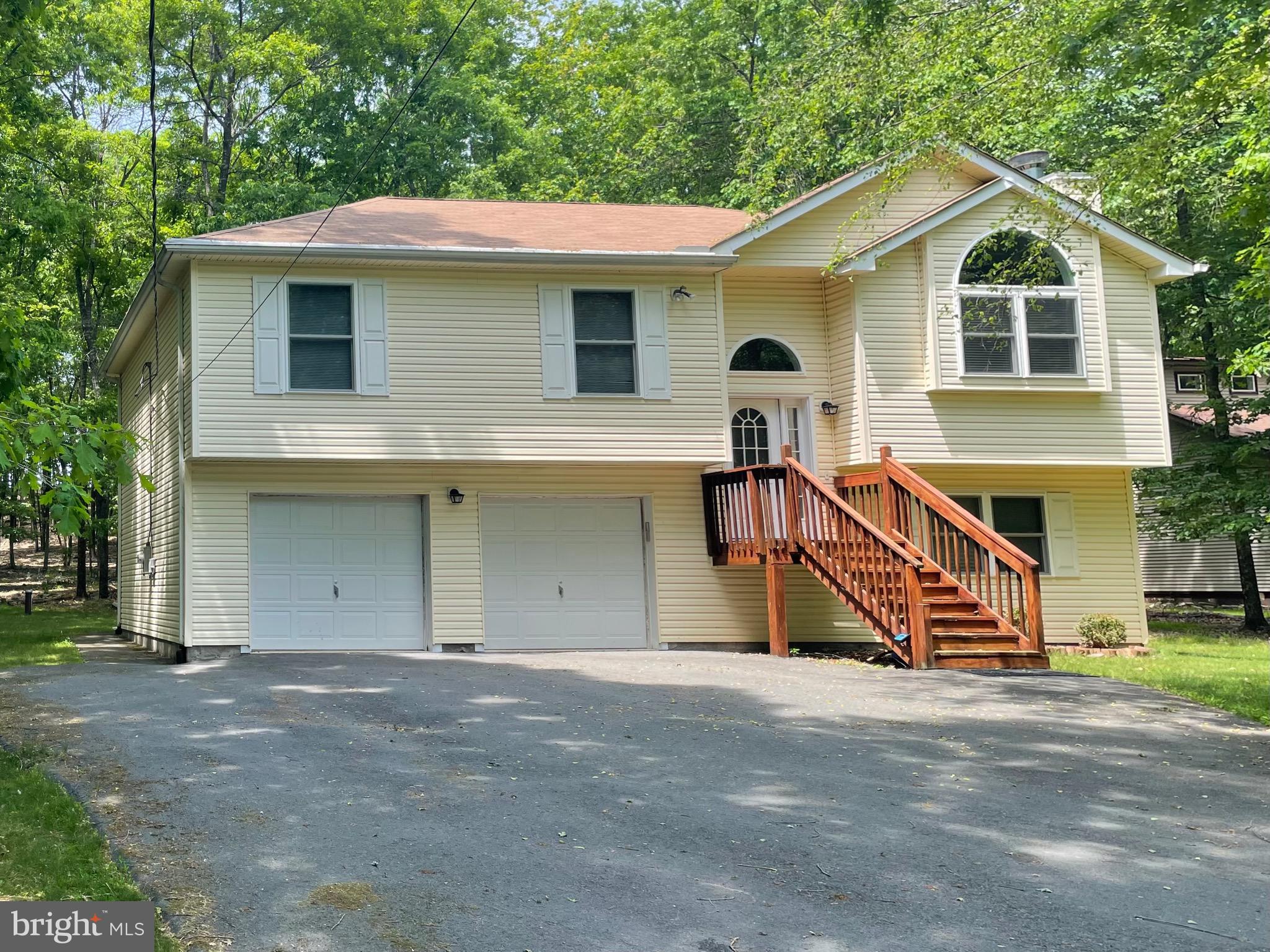 CHARMING SPLIT‑LEVEL HOME with CENTRAL A/C and CENTRAL HEAT, built in 2008, offering STRONG VALUE‑ADD POTENTIAL, negotiable FURNITURE, and located in a highly desirable AIRBnB‑friendly community.
Set on a serene, WOODED LOT, this BRIGHT and airy home offers comfortable MOVE-IN-READY living with exceptional EXPANSION POSSIBILITIES.
The main level features three well‑sized bedrooms and two full baths, creating an efficient layout for everyday living!
The EXPANSIVE unfinished lower level is a standout OPPORTUNITY—already framed with   ADDITIONAL ROOMS and rough‑in plumbing for a THIRD FULL BATH. Finish the space to CREATE a 4-5‑BEDROOM home, an IN-LAW SUITE, or a LARGE RECREATION/BONUS AREA, unlocking IMMEDIATE EQUITY and long‑term flexibility.
Enjoy OUTDOOR LIVING on the DECK with a concrete PATIO and the PRIVACY of a SPACIOUS, tree‑lined 0.69‑ACRE  lot. 
A TWO-CAR GARAGE and WIDE PAVED DRIVEWAY provide ample parking and storage.

Located in an STR‑friendly gated community with low ANNUAL DUES under $1,500, residents enjoy access to FIVE LAKES offering non‑motorized activities such as FISHING, KAYAKING, and CANOEING. Additional AMENITIES include 2 outdoor SWIMMING POOLS, a KIDDIE POOL, 4 TENNIS COURTS, and 2 BASKETBALL COURTS. The community provides 24‑hour security, road maintenance, and trash removal for added convenience.
Perfectly positioned near I‑80, the PA Turnpike, Pocono Raceway, and multiple ski resorts, this home offers both tranquility and accessibility.
Ideal for investors, STR buyers, or anyone seeking a customizable home with strong upside. Finish the lower level to your taste and maximize the property’s full potential.
Schedule your private showing and explore the possibilities.