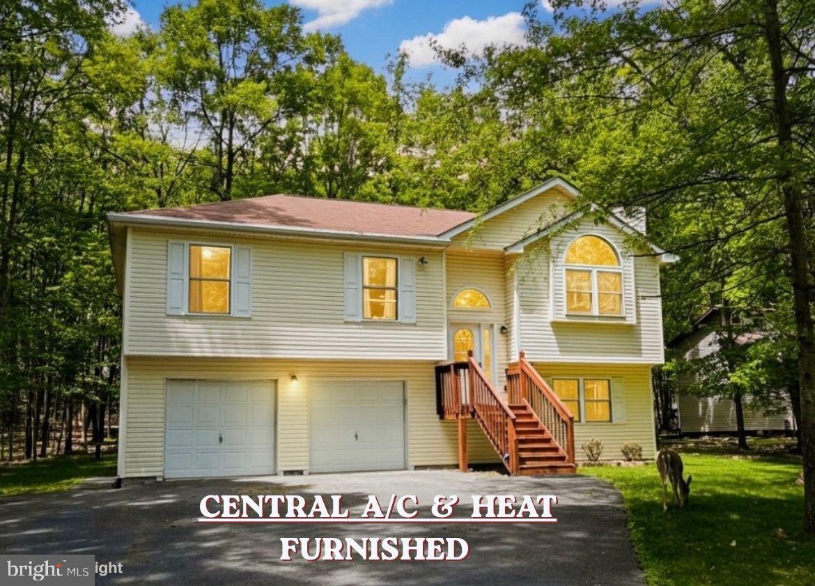 ***OPEN HOUSE: Saturday 07/18 (2pm-3pm)— Pre‑registration required with listing agent.***

CHARMING SPLIT‑LEVEL HOME with CENTRAL A/C and CENTRAL HEAT, built in 2008, offering STRONG VALUE‑ADD POTENTIAL, negotiable FURNITURE, and located in a highly desirable AIRBnB‑friendly community.
Set on a serene, WOODED LOT, this BRIGHT and airy home offers comfortable MOVE-IN-READY living with exceptional EXPANSION POSSIBILITIES.
The main level features three well‑sized bedrooms and two full baths, creating an efficient layout for everyday living!
The EXPANSIVE unfinished lower level is a standout OPPORTUNITY—already framed with   ADDITIONAL ROOMS and rough‑in plumbing for a THIRD FULL BATH. Finish the space to CREATE a 4-5‑BEDROOM home, an IN-LAW SUITE, or a LARGE RECREATION/BONUS AREA, unlocking IMMEDIATE EQUITY and long‑term flexibility.
Enjoy OUTDOOR LIVING on the DECK with a concrete PATIO and the PRIVACY of a SPACIOUS, tree‑lined 0.69‑ACRE  lot. 
A TWO-CAR GARAGE and WIDE PAVED DRIVEWAY provide ample parking and storage.

Located in an STR‑friendly gated community with low ANNUAL DUES under $1,500, residents enjoy access to FIVE LAKES offering non‑motorized activities such as FISHING, KAYAKING, and CANOEING. Additional AMENITIES include 2 outdoor SWIMMING POOLS, a KIDDIE POOL, 4 TENNIS COURTS, and 2 BASKETBALL COURTS. The community provides 24‑hour security, road maintenance, and trash removal for added convenience.
Perfectly positioned near I‑80, the PA Turnpike, Pocono Raceway, and multiple ski resorts, this home offers both tranquility and accessibility.
Ideal for investors, STR buyers, or anyone seeking a customizable home with strong upside. Finish the lower level to your taste and maximize the property’s full potential.
Schedule your private showing and explore the possibilities.