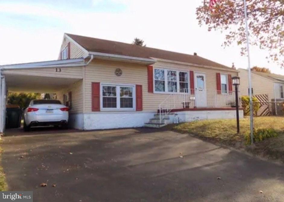 Seller is motivated, bring your offer! This 3 bedroom, 2 full bath split level home is conveniently located in the Green Lynne neighborhood, close to major roadways, shopping and dining. Enter into the spacious Living Room, with hardwood flooring under the carpet, and offers flexible use such as a separate Living Room and  Dining Room . Straight ahead you will find the Kitchen with electric cooking, built-in microwave, dishwasher, refrigerator & plenty of cabinet & counter space. Down the hall find a convenient main level Bedroom with 2 closets and hardwood flooring & a full bath  with walk-in jetted tub with seat. Upstairs you will find another bedroom with hardwood flooring & plenty of storage space. The lower level offers another bedroom with new laminate plank flooring. Down another level you will be treated to a full basement, not often found in Levittown, with large recreation room with bar, a full bathroom with stall shower & new laminate plank flooring, a storage/utility/workshop & laundry area with included washer & dryer. The fenced backyard is level & offers a nice-sized shed with electric. This home has central air conditioning & the solar panels on the rear of the house will significantly lower your monthly electric bills. In addition, the seller is providing a basic one year home warranty to the buyer at closing! Come see this home today, you won't be disappointed!