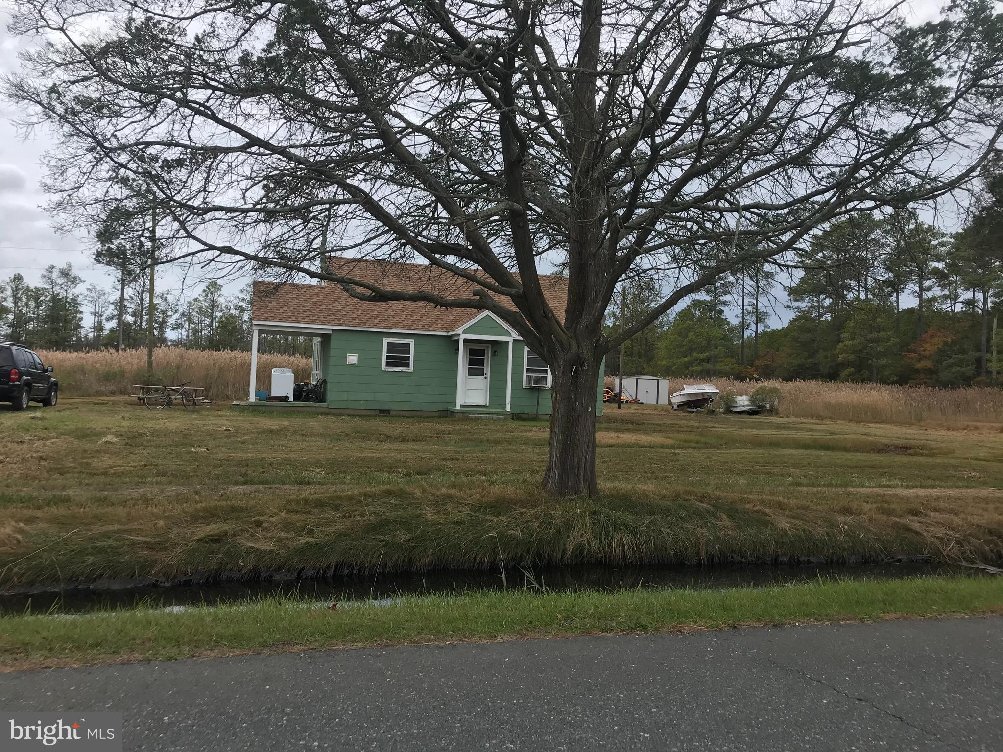 This  bungalow is located in the quaint, water oriented community of Toddville.    It has had some repairs including a brand new architectural shingled roof.  More repairs still needed-likely new well is needed.  Great get away or hunting/fishing cabin, or primary residence if you are seeking peace and quiet!  Elijah's store is just down the road, so no need to drive to Cambridge for supplies. Prior contract fell thru due to personal reasons of buyer.