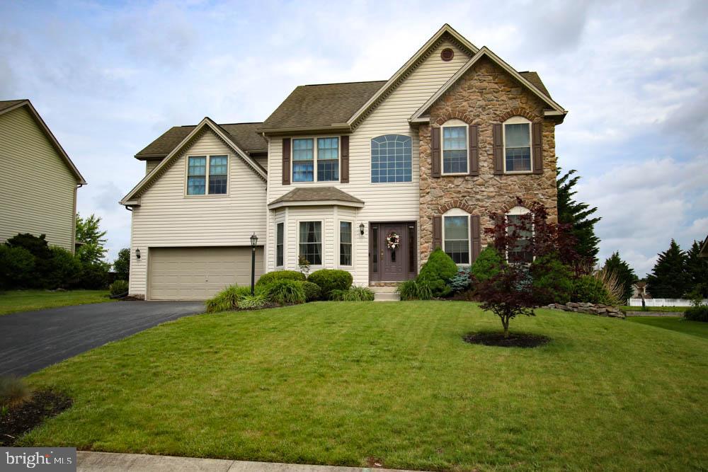 Gorgeous Home! Move in Ready, look no further, this one will fit like a glove. Open floor plan that was made for entertaining. Beautiful iron rod railings. Formal  DR, with crown Moulding & chair rail. Hardwood floors.  Unique stone wall with a grand foyer, 1st floor office for that work at home professional. Over sized master BR with soaking tub, spacious walk in closet w/ sitting room. Grand 2 story Great room with gas fireplace, Walk out to a flat spacious yard that opens up to a common area which adds tons of space. Shuffle down stairs to the Media Room with a wet Bar, for the gang, then work off those carbs in the gym with padded floor included. Spacious garage with tall ceilings and built in storage.  Need I say more set up your showing today!