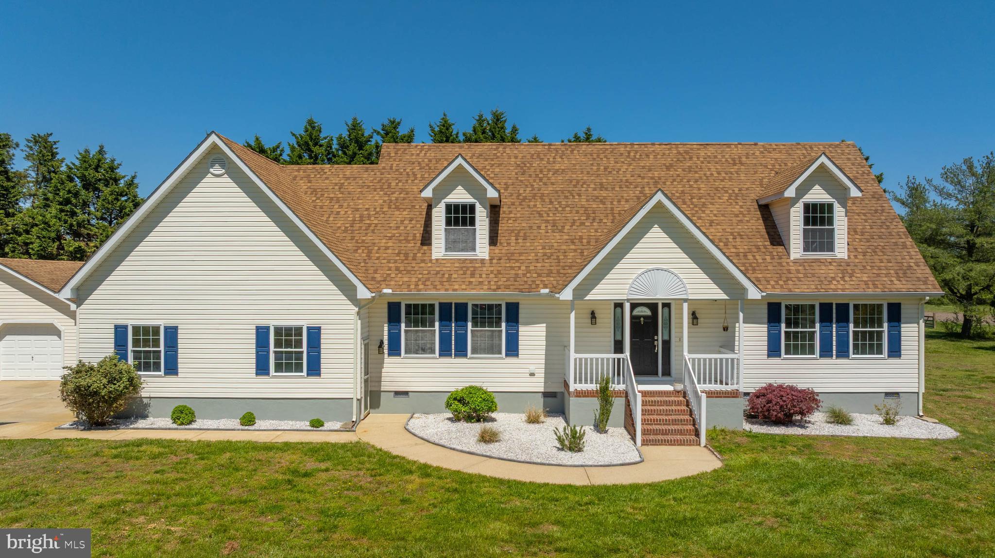 Welcome to a country setting at the beach featuring a completely renovated home featured on a spacious one acre lot.  From this home, you're around 10-15 minutes drive to either Fenwick or Bethany Beach without ever feeling the hassle of the summer crowds (unless it's what you want.). This newly renovated home is turnkey and loaded with upgrades. Step inside to fresh anti-microbial paint, stylish ship-lap and board-and-batten accent walls, and brand-new lighting throughout. The kitchen shines with new quartz countertops, an Italian marble backsplash, new kitchen appliances to match. The sunroom features new porcelain tile flooring, and you’ll enjoy unlimited hot water thanks to a new tankless water heater.  Every bathroom has been refreshed with new custom tiled showers, new toilets, a new second-floor bathtub, with premium fixtures. The home also has newer carpet in the three bedrooms, new flooring in the common areas, new stairs, six new ceiling fans, and a new LG washer and dryer. Outside, you’ll love the recently upgraded deck with under-deck storage.  Pull into your freshly sealed driveway while being greeted by new Texas white stone landscaping and a freshly painted foundation. A new well pump and bladder tank provide unlimited outdoor irrigation for gardening, washing cars etc, plus there’s a new pool pump ready for summer fun.   Additional features include a new HVAC system installed in 2022, a two-car garage, a separate one-car garage with attic storage and electricity, a HUGE walk-in attic, no HOA, and plenty of room for outdoor activities. With so many recent updates, this home is truly move-in ready.