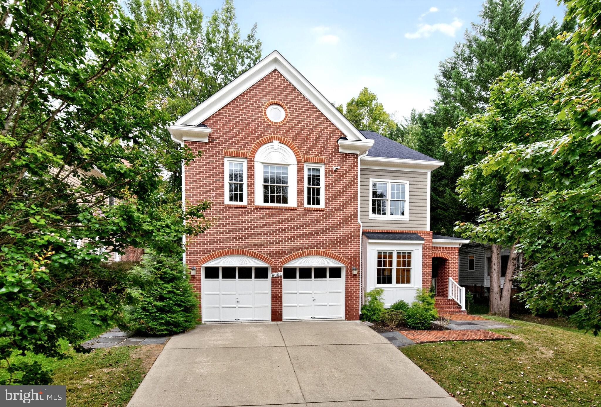 Captivating colonial-style home located in the popular Chevy Chase Ridge section of Rock Creek Forest, an established Chevy Chase neighborhood that borders Rock Creek Park. Highlighted by a brick covered front entry, rear brick courtyard patio, and a dramatic open floor plan with soaring ceilings and approximately 5,200 square feet of finished living space. The home is great for grand-scale formal entertaining and yet warm and inviting for casual living. The main level features a stunning two-story foyer with hardwood floor, beautiful moldings, and hardwood staircase; step-down living room with crown molding, recessed lighting, and hardwood floor; formal dining room with attractive moldings, recessed lighting, hardwood floor and bay window; study with hardwood floor, crown molding, recessed lighting, and wet bar; tablespace kitchen with recessed lighting, island, quartz countertops, and an abundance of cabinets; step-down family room with crown molding, hardwood floor, fireplace, and French Doors providing access to the patio; powder room with hardwood floor and pedestal sink; and a two-car garage. The upper level features an owner’s suite that spans nearly forty feet and features cathedral ceiling, sitting area, two large walk-in closets, and remodeled (2014) luxurious owner’s bath with soaking tub, double bowl vanity, and spacious separate shower; a second bedroom with cathedral ceiling and large palladium window; two additional large bedrooms with cathedral ceilings; walk-in laundry closet with washer and dryer; and updated hall bathroom. The lower level features a large recreation room with built-in bookcase, fireplace, and luxury vinyl plank floor; office or gym with closet; kitchenette; mudroom area with exit to rear yard and walk-in storage closet; full bathroom with linen closet; and large storage/utility room. The home is very convenient to Washington DC, downtown Bethesda, historic Kensington, and downtown Silver Spring. It also is within minutes of Rock Creek Forest Elementary School, Rock Creek Shopping Center, Meadowbrook horse stables and Community Park, Candy Cane City shelter house and athletic facility, Rock Creek Park trials and paths, and places of worship. Additionally, the home is within three miles of Bethesda and Silver Spring Metro Stations, a short drive to the Beltway and other major commuter routes, and convenient to Ride-On and Metrobus service. Note: Property is actively monitored by exterior cameras.