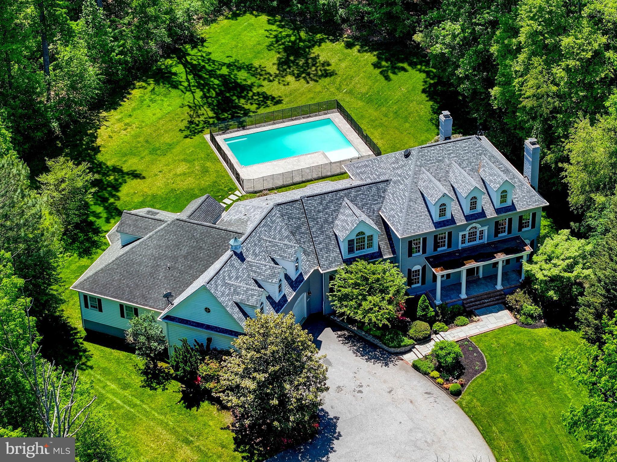 This home is ideal for Multigenerational living (two primary suites, two kitchens and 2 laundry rooms)

Set on over **three private acres** in the highly sought-after **Hereford Zone**, 1637 Cold Bottom Road in Sparks, Maryland offers an exceptional blend of space, elegance, and timeless luxury. With more than 9,000 square feet of beautifully finished living space, this remarkable brick estate is designed for both grand entertaining and comfortable everyday living.
A welcoming large front porch sets the tone, offering the perfect place to relax and take in the serene surroundings. Inside, the home features six spacious bedrooms, five full baths, and a powder room, including an impressive **primary suite on the main level** and an additional expansive primary suite upstairs—ideal for multigenerational living or hosting guests in style. Dual front and back staircases add both convenience and architectural charm, while a dedicated first-floor office with custom built-ins provides a refined workspace. Laundry rooms on both levels further enhance everyday ease.
At the heart of the home, a stunning white chef’s kitchen showcases Shaker-style cabinetry, sleek granite countertops, an oversized island, and premium stainless steel appliances. Gleaming hardwood floors, abundant recessed lighting, and three fireplaces create a warm yet sophisticated ambiance throughout.
Step outside to a resort-style backyard designed for relaxation and entertaining. Enjoy the heated Elite pool with integrated sun deck, unwind in the hot tub, and take in the extensive hardscaping and professionally landscaped grounds that elevate the outdoor experience.
Additional highlights include a three-car garage and flexible living spaces ideal for an in-law or guest suite. Located within a top-tier school district, this extraordinary property offers the perfect combination of luxury, privacy, and convenience.