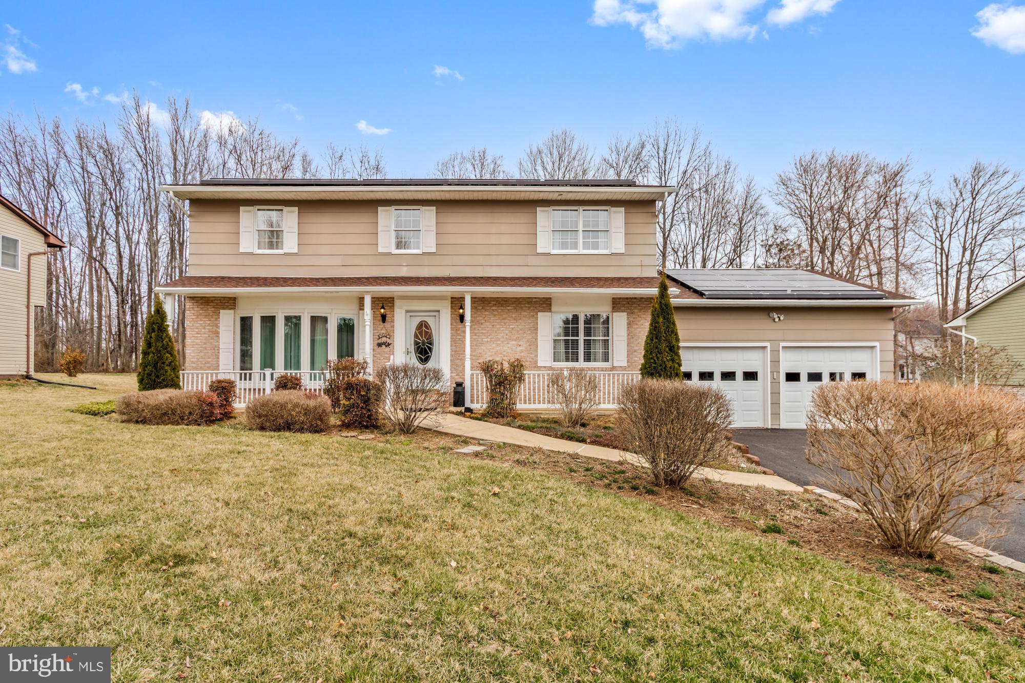 Welcome home to this meticulously maintained single-family gem, proudly sold by its original owners! As you step onto the charming front porch and enter the home, you're greeted by one of three spacious living areas on the main floor. The heart of the home—the kitchen—offers ample cabinet space, a built-in pantry, and endless counter space, complete with a rolling island for added versatility. Appliances are in great shape, and you can enjoy meals at the island or in the formal dining room just off the kitchen. From the kitchen, you have clear sightlines to the two additional living spaces—one being the cozy original living room with a wood-burning fireplace, and the other an expansive rear addition featuring vaulted ceilings and abundant natural light from windows on every wall. Step outside onto your well-maintained deck, complete with a convertible awning, overlooking your fully fenced, level backyard—perfect for entertaining, pets, or play. For added convenience, the oversized two-car garage provides direct access to the home, leading into a full bathroom and a laundry room—ideal for busy households. Upstairs, you’ll find four generously sized bedrooms and two full bathrooms. The owner’s suite features its own private bath and walk-in closet, creating a comfortable retreat. The unfinished basement offers a blank canvas—whether you dream of extra living space, a home gym, or a workshop, the possibilities are endless. Recent improvements include: newer garage door, full bath on main floor added in 2016, new front windows and sunroom windows 2023, newer flooring throughout, HVAC 2020 and much more! Don't miss this opportunity to own a move-in-ready home with modern upgrades in a lovely neighborhood! Schedule your showing today!