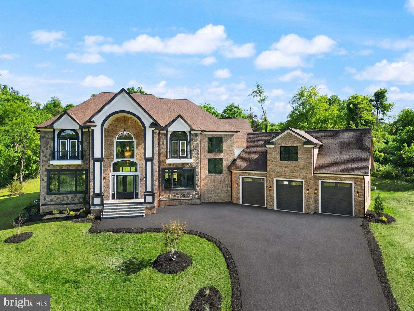 Open House Sunday 17th 1-4pm. Just Completed — Introducing an extraordinary new construction estate in the prestigious Beacon Hill community of Leesburg, Virginia. Built by renowned New Village Builders, this nearly 10,000-square-foot residence spans three finished levels and offers the perfect blend of elegance, comfort, and intentional design. Step into the grand foyer and you’re immediately welcomed by a dramatic dual curved staircase and soaring 20+ foot ceilings that create a stunning first impression and flow seamlessly into the family room. The expansive main level is anchored by a breathtaking great room with a statement fireplace and open sightlines into a show-stopping chef’s kitchen, featuring a massive island, premium luxury appliances, and custom finishes throughout. Designed for both everyday living and entertaining, the home offers formal living and dining spaces while maintaining an open-concept layout. A private office with access to a full bath provides flexibility for guests or work-from-home needs. Just off the attached 3-car garage, a custom dog wash station adds a thoughtful luxury touch for pet lovers. Take one of three staircases to the upper level, where you’ll find five spacious bedrooms, each with its own en-suite bath. The primary suite serves as a true retreat, featuring a spa-inspired bath with a grand walk-in shower, soaking tub, private balcony, and a custom walk-in closet. Above the garage, a bonus room offers endless flexibility as a second office, studio, playroom, or private lounge. The fully finished lower level offers incredible versatility with space for a future custom bar, sauna, home gym, movie theater, additional office, and more.
Step outside to a built-in grilling area and expansive outdoor space with room to create your dream backyard oasis—whether that includes a pool, fire pit, or outdoor entertaining space.
Located in the highly sought-after Beacon Hill Golf Club community, residents will enjoy the reopening of the golf course as a redesigned 18-hole championship layout, all while being just minutes from historic downtown Leesburg, wineries, dining, shopping, and major commuter routes into Washington, D.C.
This is more than a home—it’s a legacy property and a rare opportunity to own one of Northern Virginia’s most exceptional new construction estates. Welcome to Beacon Hill’s next chapter.