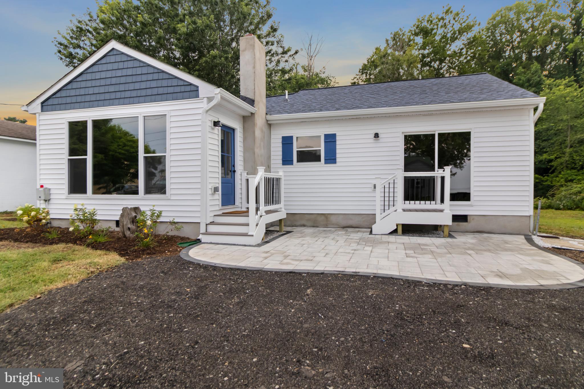 Breathtaking water views and an exceptional top-to-bottom transformation come together in this beautifully reimagined coastal retreat... Nearly every inch of the home has been thoughtfully updated, creating a fresh, sophisticated setting that feels new while preserving the warmth and character of a true waterfront escape... Step inside to a bright, open-concept interior where oversized windows frame breathtaking views of the Chesapeake Bay...A reflective UV tint was added to the Bay-facing windows, which allow you to enjoy the view all hours of the day while maintaining privacy...The beautifully renovated kitchen anchors the main living space with warm cabinetry, expansive countertops, stainless-steel appliances, a full-height tile backsplash, and an impressive island with abundant seating... Designed for effortless entertaining and comfortable everyday living, the kitchen flows seamlessly into the dining and living areas, where a classic fireplace adds warmth and character without competing with the view... The primary suite is a showstopper, offering an extraordinary water backdrop and direct outdoor access... Imagine waking each morning to the peaceful sights and sounds of the bay and ending the day surrounded by sunset skies... The additional bedrooms are generously sized, while the completely updated bathrooms feature stylish vanities, contemporary fixtures, and intentionally curated tile selections... A separate flex space provides the perfect setting for a home office, reading room, or quiet retreat... Extensive improvements include a new roof, new windows, a new HVAC system, updated electrical, and a completely renovated interior... Outside, professional landscaping, paver patio, and a paver walkway create an inviting place to relax, entertain, and enjoy the surrounding beauty... Two separate parking pads, one on Bay Ave and one on Chesapeake Ave... Steps from a private beach... This is more than a renovation—it is a thoughtfully designed waterfront retreat where the view becomes part of everyday life... Come experience the craftsmanship, tranquility, and unmistakable feeling of being home.  Schedule your showing today :)