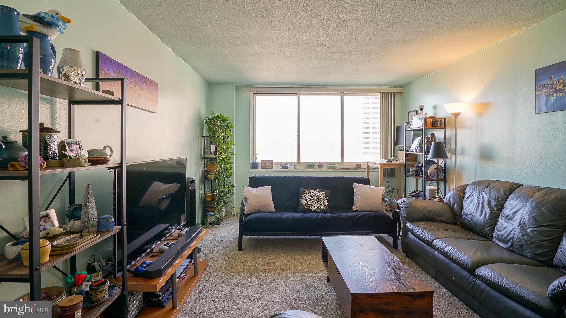 Welcome to this bright, north facing  1 bedroom, with a beautiful view and  678.20 sq. ft. of thoughtfully designed living space, waiting for you to come make it your own. The Kennedy House offers a full-service lifestyle defined by comfort and sophistication. Residents enjoy a 24-hour security, concierge, onsite management, and an attached garage. The crown jewel of the building is its spectacular rooftop pool, showcasing breathtaking panoramic views of the Philadelphia skyline. Additional amenities include a fully equipped fitness center, community room, hospitality suites for guests, bike storage, library, and laundry facilities. Your monthly fee delivers remarkable value, covering real estate taxes, electricity, air conditioning, heat, water, basic cable TV, and access to both the rooftop pool and fitness center — offering effortless, all-inclusive living. Convenience is unmatched. Located just blocks from Suburban Station and Amtrak’s 30th Street Station, with multiple bus lines at your corner, commuting is seamless. World-class dining, upscale shopping, renowned museums, and cultural landmarks are all just steps from your door. Enjoy the added luxury of having Kennedy Food Garden and na Brasa Brazilian Steakhouse located within the building itself. This is a cooperative building requiring board approval. Buyers must present strong financials and a credit score of 700+. Please note: no subletting permitted. The building allows domestic cats, and/or caged birds, but only 2 pets per residence. A one-time administrative fee of $13,564.00 applies, with nominal fees for parking and hospitality suites. Elevated city living awaits at The Kennedy House — where luxury, location, and lifestyle converge.
