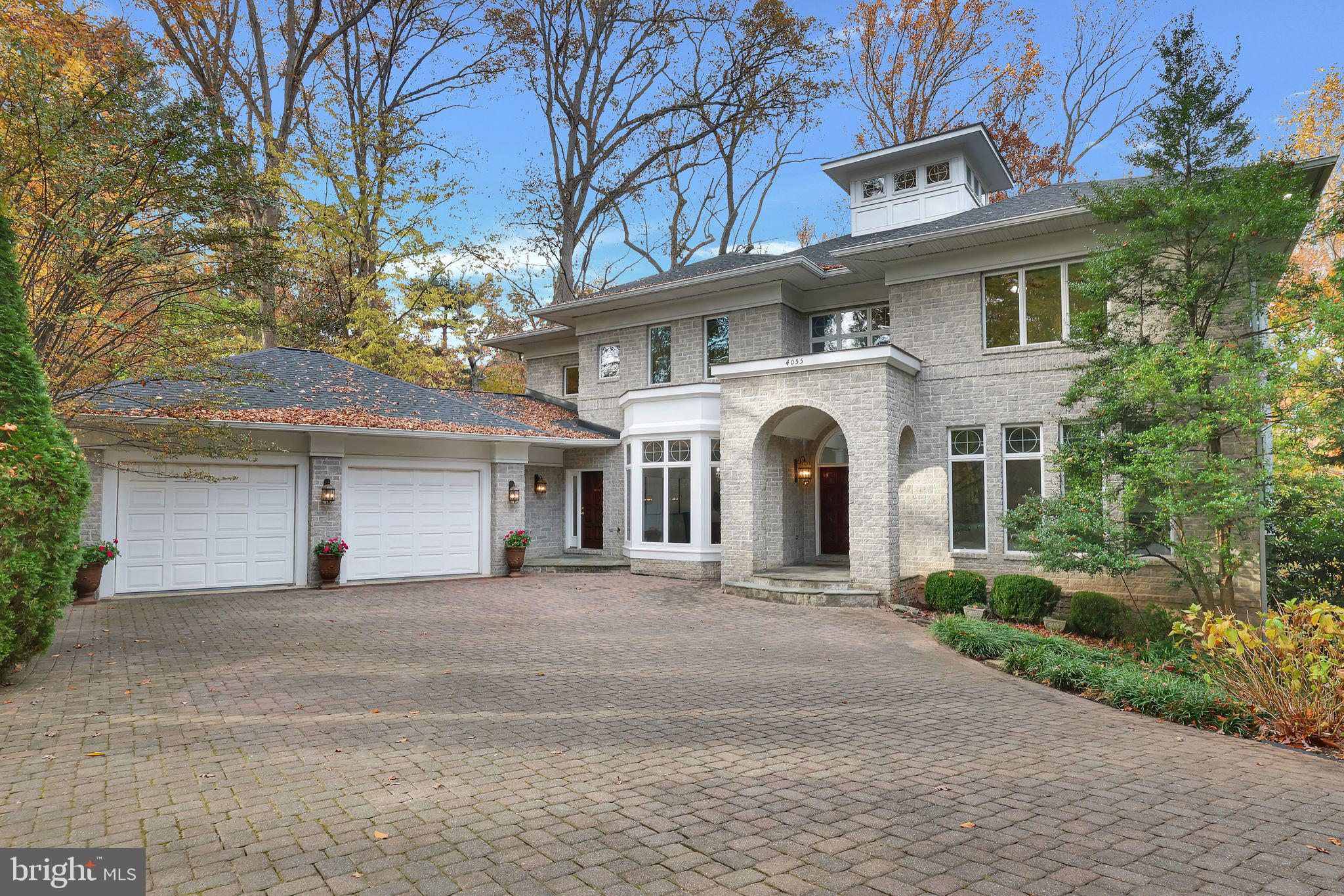 Welcome to your dream home—an extraordinary 8,000+ sq. ft. estate tucked away in one of the most prestigious neighborhoods of North Arlington, where luxury and privacy meet. This residence is a true masterpiece while still providing you with the feeling of "home". One of the most private residences in North Arlington, you will be in awe of the serene ¾ acre lot filled with mature trees.

Upon entering the home you'll be greeted by a grand entryway. Looking up you'll be enthralled by the awe-inspiring  rotunda featuring a ceiling height of over 25 feet with ambient halo lighting and 360 degrees of  windows. Through the rotunda, you will be delighted at the light-drenched living room featuring a limestone two-story fireplace and expansive windows overlooking the serenity of the property without a neighbor in sight. Directly off of the rotunda, you'll find the thoughtfully designed office for those who work from home or seek a quiet place to reflect. Adorned with elegant built-in shelving, it offers a perfect balance of functionality and style—whether you're organizing your collection of books or curating your workspace. For those who feel most relaxed when in the kitchen, you'll love the chef-inspired space which features commercial-grade SubZero and Thermador appliances, immense cabinet space, and a butler’s pantry for serving. Next to the kitchen is the three-season screened porch for quiet dinners outdoors in any weather. The expansive deck gives you complete freedom of options for use. The main floor also features an secluded en suite bedroom with full bathroom. Perfect for guests, family, or multi-generational living.

Up the luxurious circular front staircase or easy access rear staircase, you will find 4 bedrooms. The primary bedroom, secondary en-suite with full bathroom. And two oversized bedrooms with jack and jill bath. The primary bedroom features a sitting room, 3 sided fireplace, generous windows overlooking the property’s dominion. The expansive primary bathroom with separate vanities, a soaking tub, glass-enclosed shower, toilet room with bidet, and a separate makeup vanity. The colossal walk-in closet has fully built in storage and 2 entrances.

The lower level adds entertaining spaces and additional living spaces. You will love the retro diner theme, custom-made for this space. Featuring a full kitchen, it can’t be easier for you to get second helpings of popcorn during your evening movie. The movie theater features custom seating for all your friends and family, an integrated sound system, and generous screen. In addition to two large living spaces, it also features a large bedroom and fitness room with full bathroom. Enjoy the ease to walk-out on to the covered slate patio with a walkway to the fire pit circle.

The two-car garage is deep and wide, offering generous options for storage and work stations.

Down the stone steps off of the driveway, you will be amazed at your own serenity grotto – a one-of-one aspect of this property not found anywhere else in Arlington. With four levels of unique landscaping, slate walkways, and 2 stone patios. Your own private sanctuary awaits at every turn outdoors—an incredible outdoor space that feels like an extension of your home, with lush landscaping, serene lounging areas, and ample room for al fresco dining and entertaining on both the screened-in and open deck areas directly off of the kitchen. 

Whether you're hosting friends in the expansive formal areas or enjoying quiet moments in the inviting living spaces, every corner of this home exudes warmth and sophistication. This is more than just a home; it's an invitation to experience the best in luxury living, nestled in one of the most coveted and distinguished locations in the Metro Washington DC area.