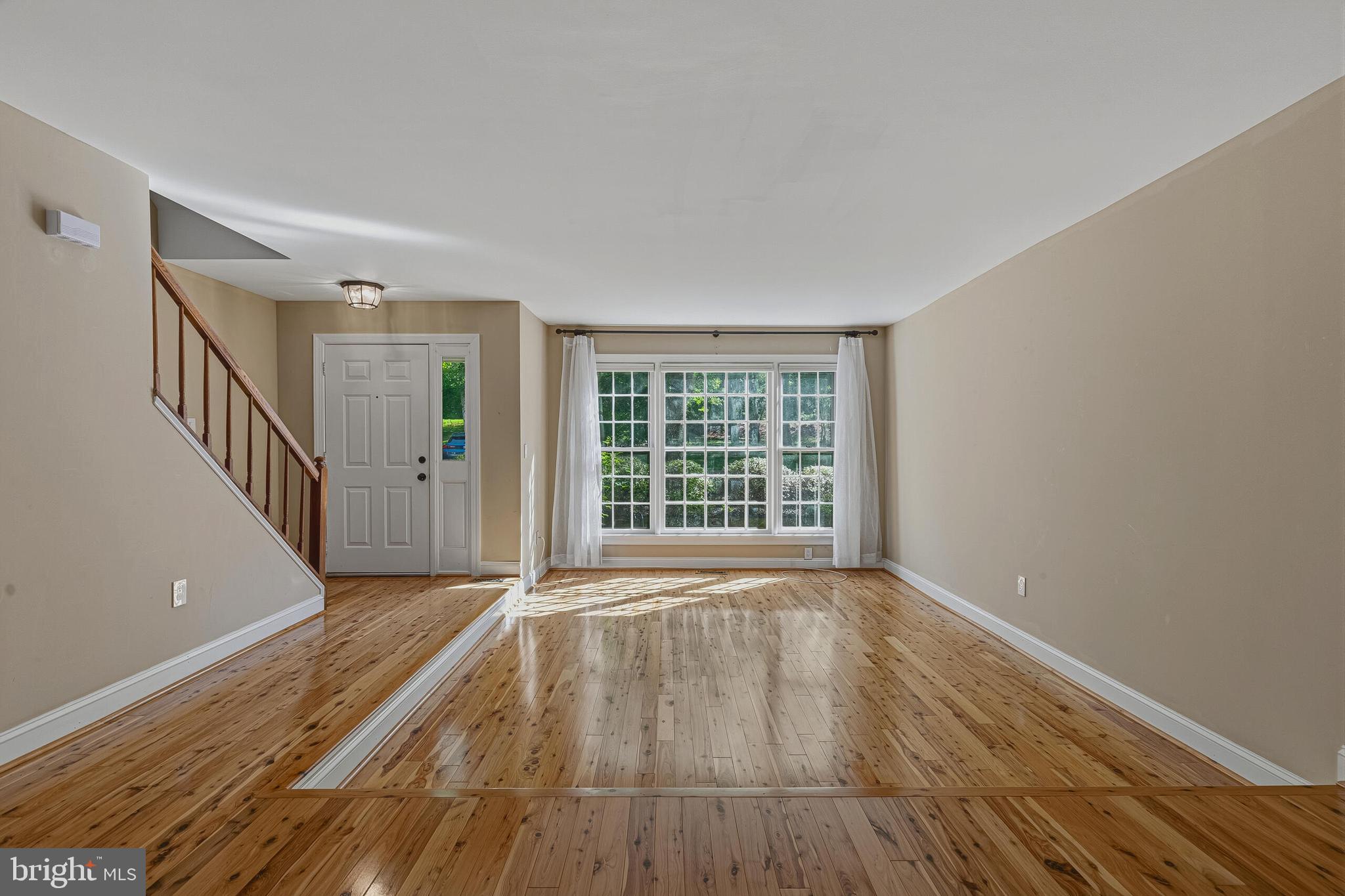 Rarely available well maintained four-level town home in Springfield! This spacious home offers nearly 2200 square feet. The upper-level features two large primary suites with vaulted ceilings and private full baths, plus a fourth-level loft filled with natural light from two skylights—perfect for a third bedroom, playroom, or home office. The open-concept kitchen connects seamlessly to the family room and offers access to the large deck, creating a wonderful flow for everyday living and entertaining. The living and dining rooms feature hardwood floors and crown moulding. The lower level includes a spacious recreation room with a gas fireplace and a rough-in for a 3rd bathroom. A sliding glass door opens to the lower deck and fenced backyard, offering additional outdoor living space and privacy. Updates: Roof with skylights -2021. 2 level deck - 2020. Water heater - 2018. Newer HVAC. Easy access to major commuting routes I-95, I-395, I-495, FFX County Parkway, OX rd, VRE commuter train, and Springfield METRO. Backs to Pohick Creek Park!