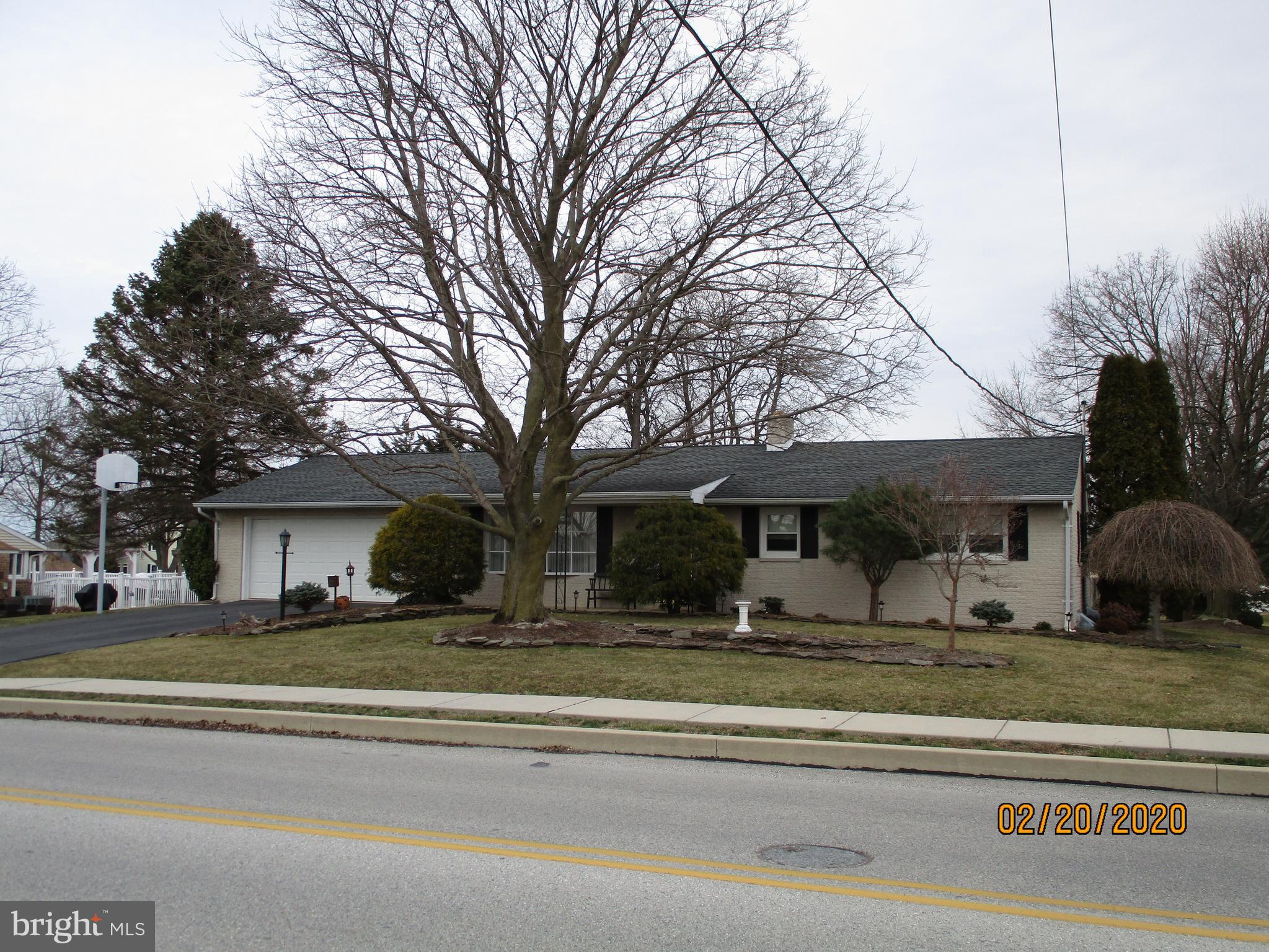Immaculately cared for brick ranch home in Manchester, just minutes away from schools, restaurants, golfing, shopping & short drive to I83. One owner home has been lovingly maintained with so many updates!  Wall to wall carpet, hardwood floors under BR carpet, crown molding, chair rail,  wainscoting, newer laminate, quartz kitchen counters, refaced cabinets,  ceiling fans and an oh so wonderful Florida room to relax in complete the first floor. There is an attached oversized 2 car garage with laundry room, utility sink and door to the rear yard. The lower level has a large family room with dry bar, welcoming white brick surround gas(propane) fireplace w/flagstone hearth, wall to wall carpet, a large game room w/rear yard access via walk up stairway and a possible 4th bedroom, office, or sewing/craft room. The full bath offers a corner stall type shower and multiple closets, one cedar lined. The utility room houses the furnace, water heater, sump pit & pump , the furnace & a wine rack area. Behind the utility room is a large partially finished room that just needs your vision to give you more living space! The sunroom opens to a generously sized deck with a retractable awning for extra shade in the sultry summer days. The yard offers plenty of play space, lovely walking paver areas, stone hardscape, a nook for your grill or a fountain and lovely landscaping beds. The large barn type shed offers a mower/lawn tractor concreted floor garage and a large workshop shed with workbench, loft space and electric.  Columbia Gas is in the Street at Board Road and at Fenwich/Malvern Drives.  Just a few blocks to the middle and high schools for all those great events, and Royal Manchester golf course. Don't wait to see this cutie!