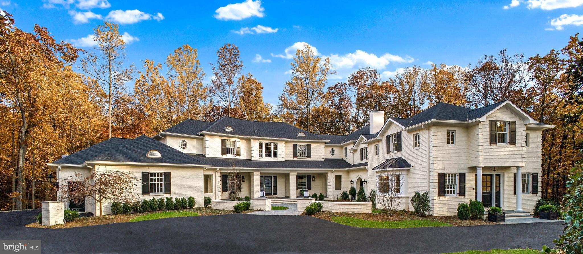 Nestled on over 5.5 acres in the wooded hills of Caves Valley, this  custom-built estate home was expertly crafted and meticulously curated by the dream team of Vince Green architecture, J. Paul Builders and Jay Jenkins of Jenkins/Baer design.  This home boasts exquisite finishes and unparalleled attention to detail that would cost more than twice the list price to recreate.  As you enter through the grand foyer, you are greeted by soaring ceilings, natural stone tile and hand-scraped walnut flooring, custom-designed lighting, and an abundance of natural light that accentuates the open floor plan. The gourmet kitchen featuring an addition from 2013 and a top to bottom renovation, is a chef's dream. Featuring state-of-the-art Wolf and Subzero appliances, a spacious island and all custom cabinetry with crystalized glass countertops, and bluestone tile floor. Entertain guests effortlessly as you flow from the kitchen into the expansive family room with a cast stone gas fireplace and coffered ceilings. Follow the flow into the inviting and impressive den with another fireplace, an all wood ceiling and breathtaking architectural brick archways housing the bar and french doors to the outdoor pavillion. Truly an entertainer's dream, this oversized hardscaped Pavilion with its fireplace, dining and seating areas flows effortlessly to Patios and Gardens including a covered Porch off the Kitchen with an outdoor grill area. Back inside, a formal living area off the foyer, an expansive dining area, a home office with 3 workspaces, 2 powder rooms, a main level Laundry Room and oversize 3-car Garage complete the Main Level.  Upstairs enter into your own private sanctuary of luxury in the primary suite complete with a spa-like bathroom and oversized walk-in closets galore. Also on the 2nd Level are 4 additional Bedrooms.  Each additional bedroom is generously sized and appointed with its own en-suite bathroom, providing comfort and privacy for family and guests. There is also a 2nd floor additional Laundry Room. The walk-out Lower Level features Bedroom 6 and Bath, 2 Exercise Rooms and a large Bonus Room that would make a 
 perfect theater. There is an attached 3-level Guest suite and or private office complex that gives new meaning to the phrase "work from home". Other notable features of this home are lighting by Bob Jones and landscape design by Bob Jackson, endless parking options & Proximity to the adjacent Caves Valley Golf Club.  Indulge in the epitome of luxury living with this custom-built home, where every detail coalesces to create a true masterpiece.  Schedule your private tour and discover all the wonders of this one-of-a-kind property.
