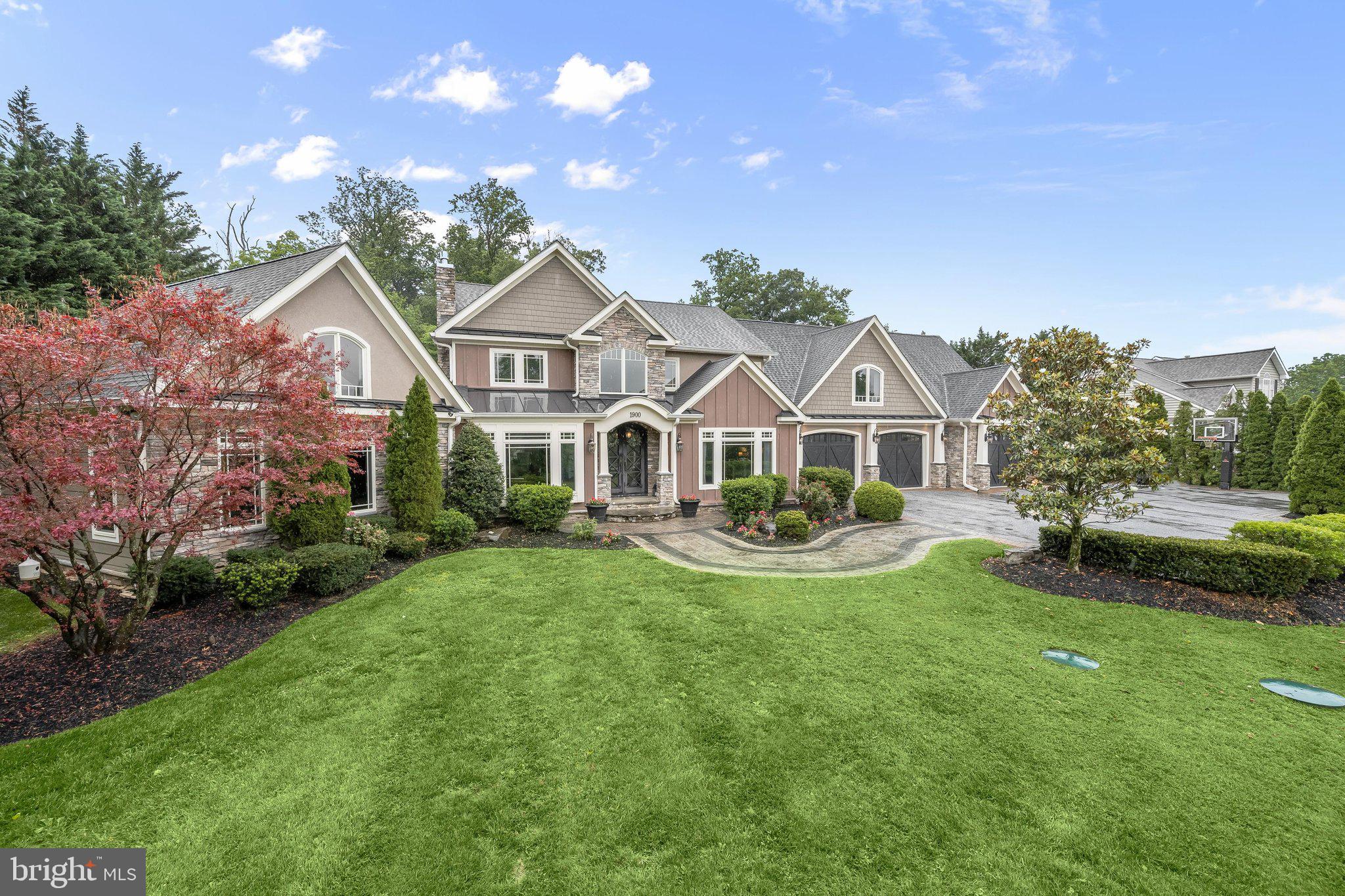 Experience exceptional luxury and privacy in this extensively renovated custom estate tucked away at the end of a cul-de-sac in the sought-after Peppermint Springs community. Set on more than an acre surrounded by mature trees and offering the rare advantage of no HOA, this remarkable residence combines sophisticated design, resort-style outdoor living, and thoughtfully curated finishes throughout.
A winding custom hardscaped walkway welcomes you to the impressive double-door entry, where soaring ceilings, designer lighting, and wide-plank hardwood floors create an unforgettable first impression. Designed with both everyday living and grand-scale entertaining in mind, the heart of the home is the stunning gourmet kitchen. Featuring custom KraftMaid cabinetry, a massive granite island, under-cabinet lighting, elegant backsplash details, stainless steel appliances, wine storage, a beverage refrigerator, pantry, and abundant storage solutions, this space is as functional as it is beautiful. The adjoining breakfast area offers window bench seating and corner windows with views of the outdoor oasis, while the kitchen flows seamlessly into the inviting family room anchored by a gas fireplace.
The outdoor living experience rivals that of a private resort. The stunning pool serves as the centerpiece of the professionally landscaped backyard, complete with a new pool liner, waterfall, diving board, expansive patios, and dedicated recreation space, all enclosed by fencing and surrounded by mature landscaping for exceptional privacy.
The main-level owner's retreat is a destination unto itself. Vaulted ceilings with rustic beams, a stone gas fireplace, custom built-ins, motorized blinds, and a private sitting area create a serene atmosphere. The spa-inspired en-suite bath showcases heated marble floors, an oversized dual rainfall shower, soaking tub, elegant designer finishes, and a dedicated hot water heater. Completing the suite is a custom walk-in closet featuring a marble-topped center island, extensive built-in organization, and a private laundry area.
Additional main-level highlights include a cozy living room, elegant dining room, stylish powder room, functional mudroom, and an oversized three-car garage with extensive built-in storage and a dedicated storage room. Upstairs, multiple loft spaces provide flexible areas for reading, study, or recreation, while five generously sized bedrooms, well-appointed bathrooms, and a second laundry room offer exceptional comfort and convenience.
The finished lower level expands the home's impressive living space with a game room, theater room, guest bedroom with direct walkout access to the backyard and pool area, and abundant room for entertaining. Additional features include dual-zone HVAC, an invisible pet fence, and a Ring security system.
