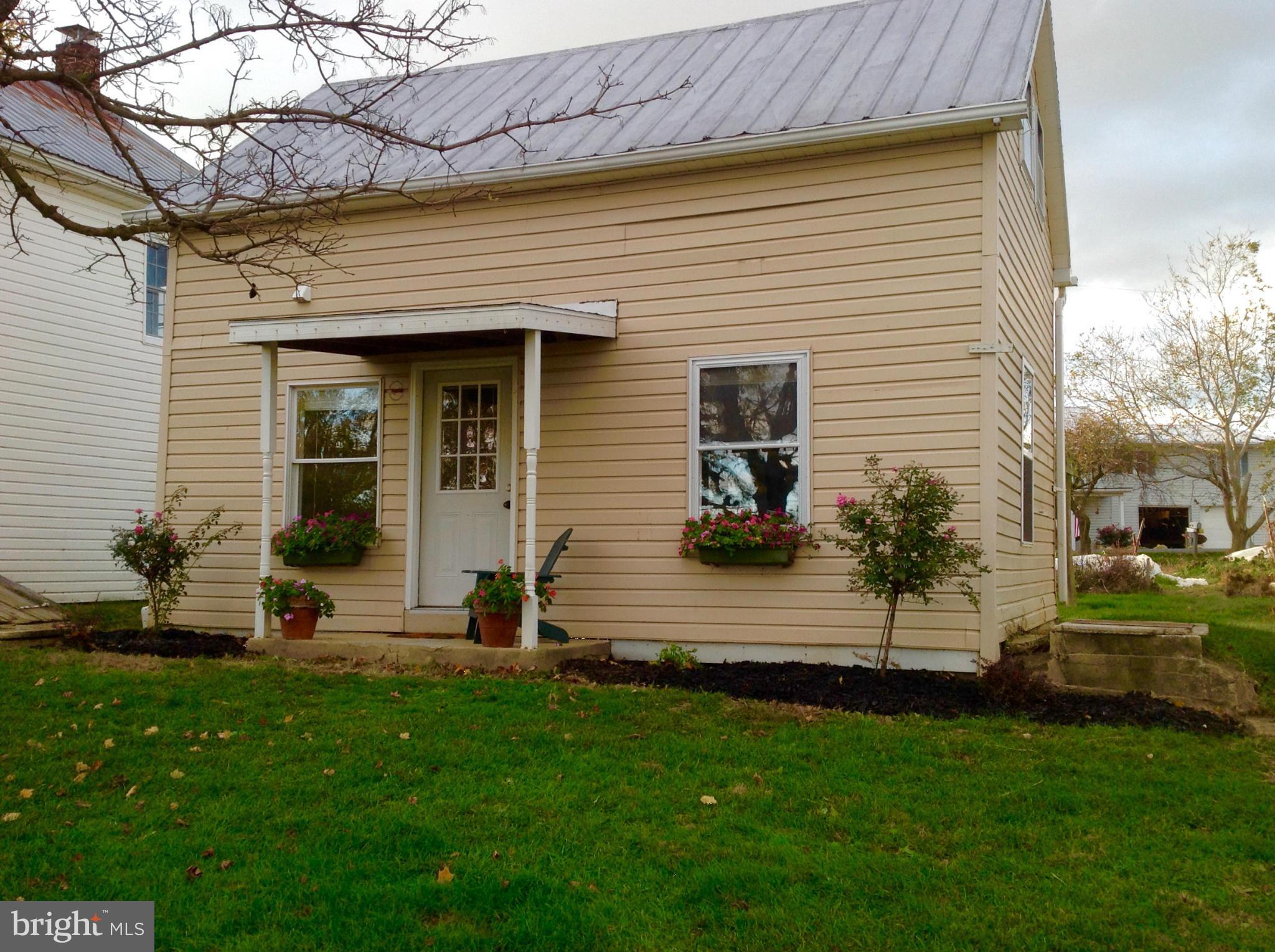 This remodeled cottage style home is ready to go! If you are looking for peace and quiet in a country setting this is for you.Large yard, extra storage, amazing views,  yet close to town!
