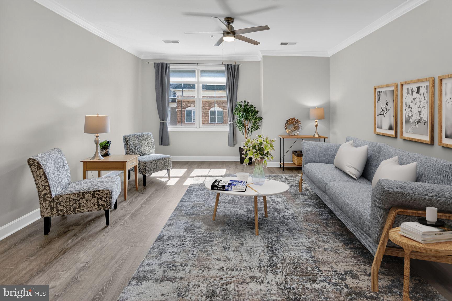 Move right into this sun-filled, southern-facing two-level condo that lives like a townhome while offering the ease of low-maintenance living—perfectly perched above the vibrant shops and restaurants of King Farm Village Center in Rockville. Freshly painted and beautifully refreshed, this home shines with brand-new Luxury Vynel Plank flooring and an open-concept main level filled with natural light.

The stylish kitchen is both functional and inviting, featuring granite countertops, stainless steel appliances, under-cabinet lighting, and a breakfast bar with abundant storage. The open dining and living areas flow seamlessly together, creating an inviting, spacious setting that’s perfect for entertaining guests or enjoying everyday living. A well-appointed powder room with upgraded features completes the main level.

Upstairs, two generously sized bedrooms each offer renovated ensuite baths with designer tile, vanities, lighting, and fixtures—creating ideal privacy for guests, roommates, or a home office setup. The upper-level laundry adds everyday convenience, and the thoughtful two-level layout provides comfortable separation of living and private spaces.

This boutique building (just 25 residences) offers a quiet, well-maintained atmosphere along with amenities including assigned parking, private storage, bike storage, a fitness center, and a community room. As part of the highly desirable King Farm community, residents enjoy access to pools, parks, playgrounds, sports courts, and a free shuttle to Shady Grove Metro—plus walkable access to Safeway, dining, coffee shops, and everyday conveniences just steps from your door.

With easy access to Route 355, I-270, I-370, NIH, and the Metro, this location is ideal for commuters while delivering a true live-work-play lifestyle. Rarely available two-level layouts like this offer larger square footage and exceptional value—making this not just a beautiful home, but a smart investment in one of Rockville’s most dynamic and walkable communities.