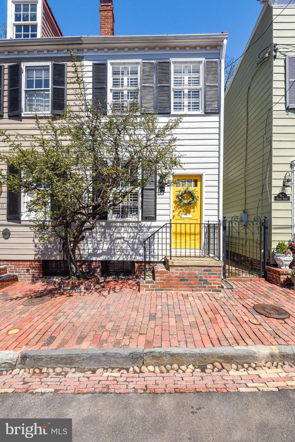 The Home has the Charm of 1840  Colonial with original Wood Floors, Wood Burning Fireplace, a Private Brick Patio and 3 Finished Levels. Recently replace HVAC, Water Heater, Dishwaher, Washer & Dryer, 3rd Floor AC Wall Unit .The  Gourmet Kitchen has Granite Counter, Stainless Appliances and Tile Flooring. Bath has been updated with Jetted Tub, Granite topped Vanity Ceramic Tile and Custom Cabinets. Home has just been painted. Unfinshed Basement for Storage. Fenced Back Yard with Large Storage Shed. Great location in the Southeast Quadrant of Old Town. Walk to  King St. and all Old Town  Shops, Restaurants, Water Front and Parks