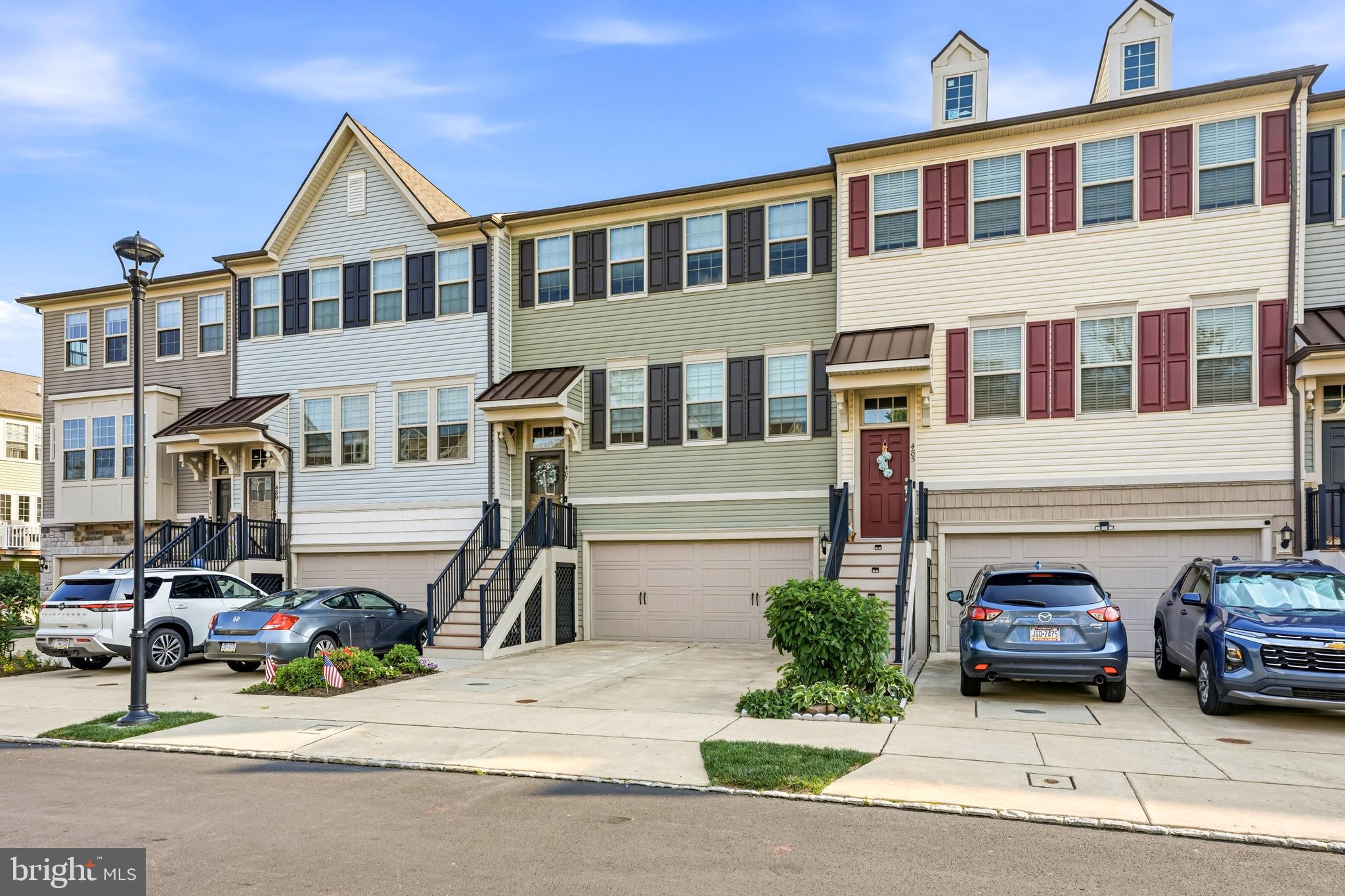 Welcome home to 487 Rowan Street, a gorgeous 3-story townhome offering 2,400 square feet of contemporary living space in the heart of Warminster. Built in 2018, this bright and airy property has been impeccably maintained and is completely move-in ready.

Step inside to an expansive, open-concept main floor designed for both effortless daily living and lively entertaining. The chef-inspired kitchen serves as the heart of the home, featuring premium builder upgrades, sleek countertops, and ample cabinetry. The kitchen flows seamlessly into the sun-drenched living and dining areas, which open directly to a private rear deck—your absolute go-to spot for morning coffee, weekend barbecues, or relaxing evening wind-downs. A convenient powder room completes the level.

Upstairs, the impressive primary suite offers a true sanctuary from the daily grind. It boasts an expansive bedroom area, a massive walk-in closet, and a spa-like en-suite bathroom complete with a double vanity and sleek finishes. Two additional generously sized bedrooms share a pristine hallway bath. Unmatched storage is a theme throughout, highlighted by an oversized walk-in hallway linen closet. For ultimate convenience, the dedicated laundry area is also located on this floor.

The lower entry level provides fantastic flexibility, perfect for a home office, media room, or gym, alongside an additional powder room. Storage and parking are a breeze with the attached 2-car garage.

Nestled in a peaceful, sidewalk-lined neighborhood within the Centennial School District, you are just minutes away from local parks, premier shopping, dining, and public transit for an easy commute.
Don't miss your chance to own this exceptional modern home. Schedule your tour today!