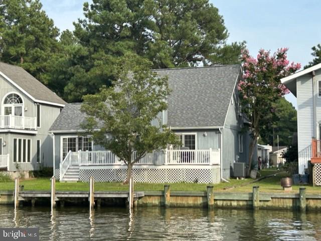 NEW PRICE! Bring your paint bush and ideas for updates to this custom-built 3 bedroom plus bonus room 2 1/2 bath Saltbox style waterfront home with a 2 car garage and added Sunroom. Seller added a 1/2 bath on first floor so Primary bedroom has a private bath. Roof replaced in Summer of 2022. 4 x 22 dock has just been power washer and easy boat access to the River, Bay and Ocean with no bridges to go under. Hardwood floors in Living and Dining rooms. Washer and dryer plus laundry sink in garage.  Seller has purchased an HVAC window unit for Bonus room and is still in the box. Access to bonus room is thru one of the bedrooms. Bonus room has several storage closets. Garage entry door with access to covered front porch. Nice 8 x 28 rear deck . This home was a primary residence for many years. Seller will consider giving a $4500 decorator allowance for an acceptable offer.