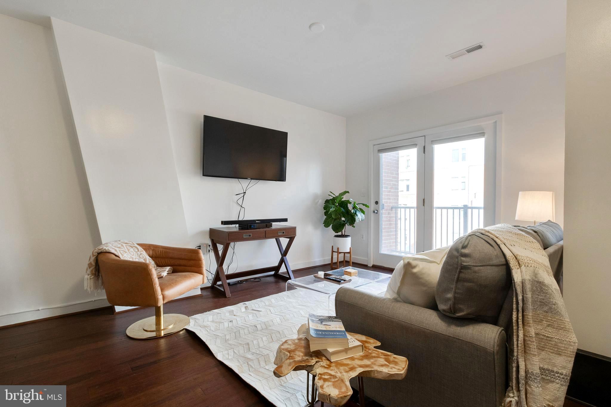 Meticulously maintained 2 bedroom/2 bathroom condo unit in a highly desirable location with 2 assigned garage spaces and a  secure storage space! Walkable to almost everything living in this secure building means you are steps away from shopping, eateries of Del Ray, the metro, Crystal City, Amazon HQ2, Reagan National Airport and just a few lights to DC. This spacious condo features 11-foot ceilings, new beautiful hardwood flooring throughout, a private balcony, large pantry, stackable washer and dryer, built in microwave, gas stove, dishwasher, granite counters and.... Wonderful community amenities include a fitness room, rooftop deck, billiard room, meeting room, party room, bike storage and more.  Pet Friendly with no restrictions! New Potomac Yards Metro Station coming soon! Don't miss out!