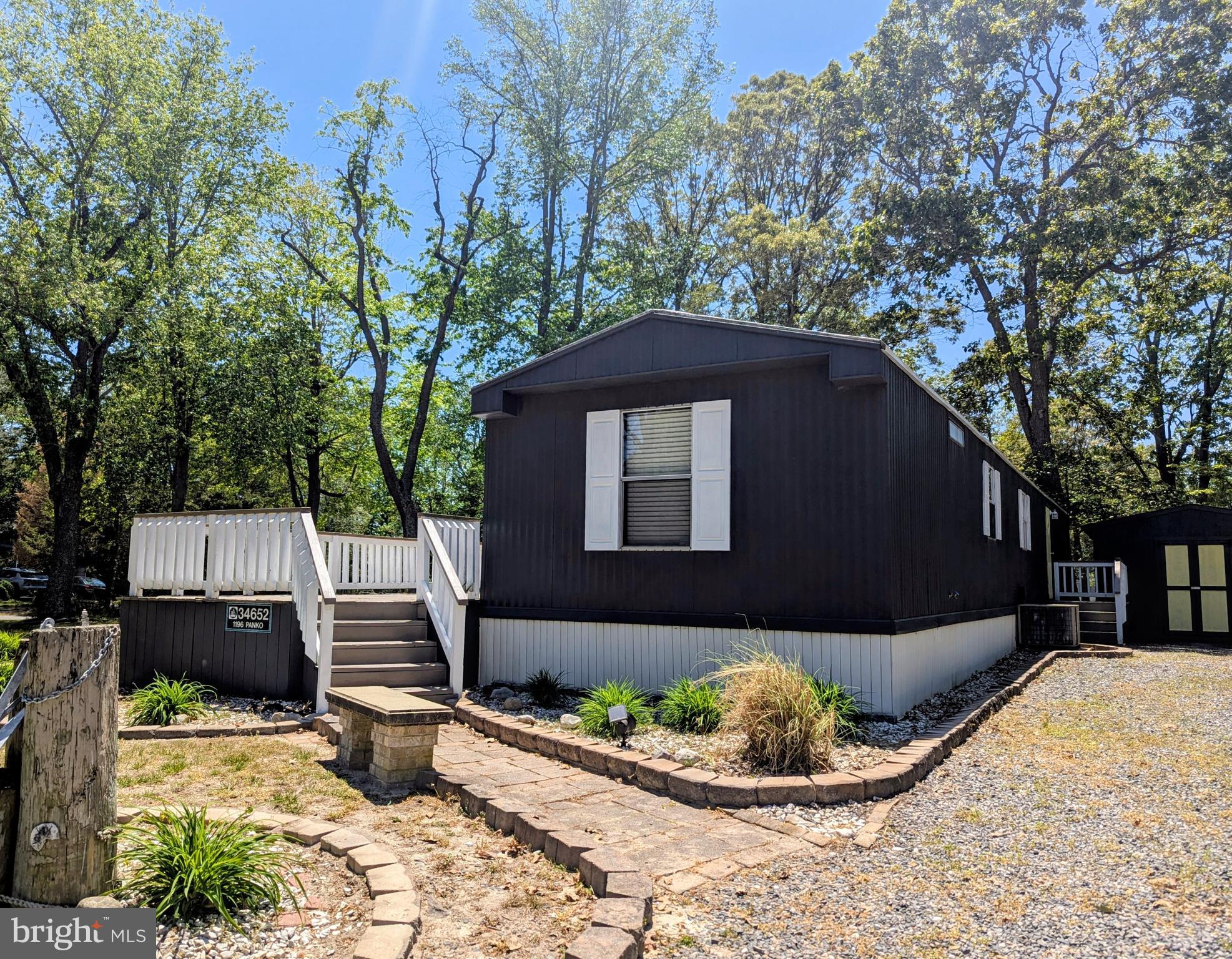 PRICE IMPROVEMENT!! Great new listing in Pot-Nets Creekside!  Imagine a country setting at the beach! This recently refurbished home is situated on a huge corner home site with plenty of room for your kids and dogs to play!  The owner has done a long list of work to the home to prepare for a new family!  There is a brand new front door/storm door, freshly painted 30 ft. long front deck, new light and ceiling fan fixtures, newer Stainless appliances, wood laminate flooring,  granite Kitchen countertops with maple cabinets and a large Kitchen sink for those big crab pots!  The main bedroom has an attached bathroom with a tub/shower unit and the second bedroom is adjacent to the Hall Bath, which also has a tub/shower.  The Living Room and Dining area feature window cornices, decorative posts and French style room dividers, upgraded trim and all newly painted throughout the home.  Pot-Nets Creekside  offers a community in ground swimming pool, boat ramp, crabbing dock, Nature Preserve with boardwalk, Osprey platforms, Playground with new equipment and lovely views of the creek and Rehoboth Bay in the distance.  There is a new golf car path that leads to Pot-Nets Bayside and residents may enjoy all amenities in all six Pot-Nets, which include private beaches and outdoor sports.   Lot rent is $966 per month including trash/recycle/yard waste.
***NOTE!! Furnace does not work, will need to be replaced. ***