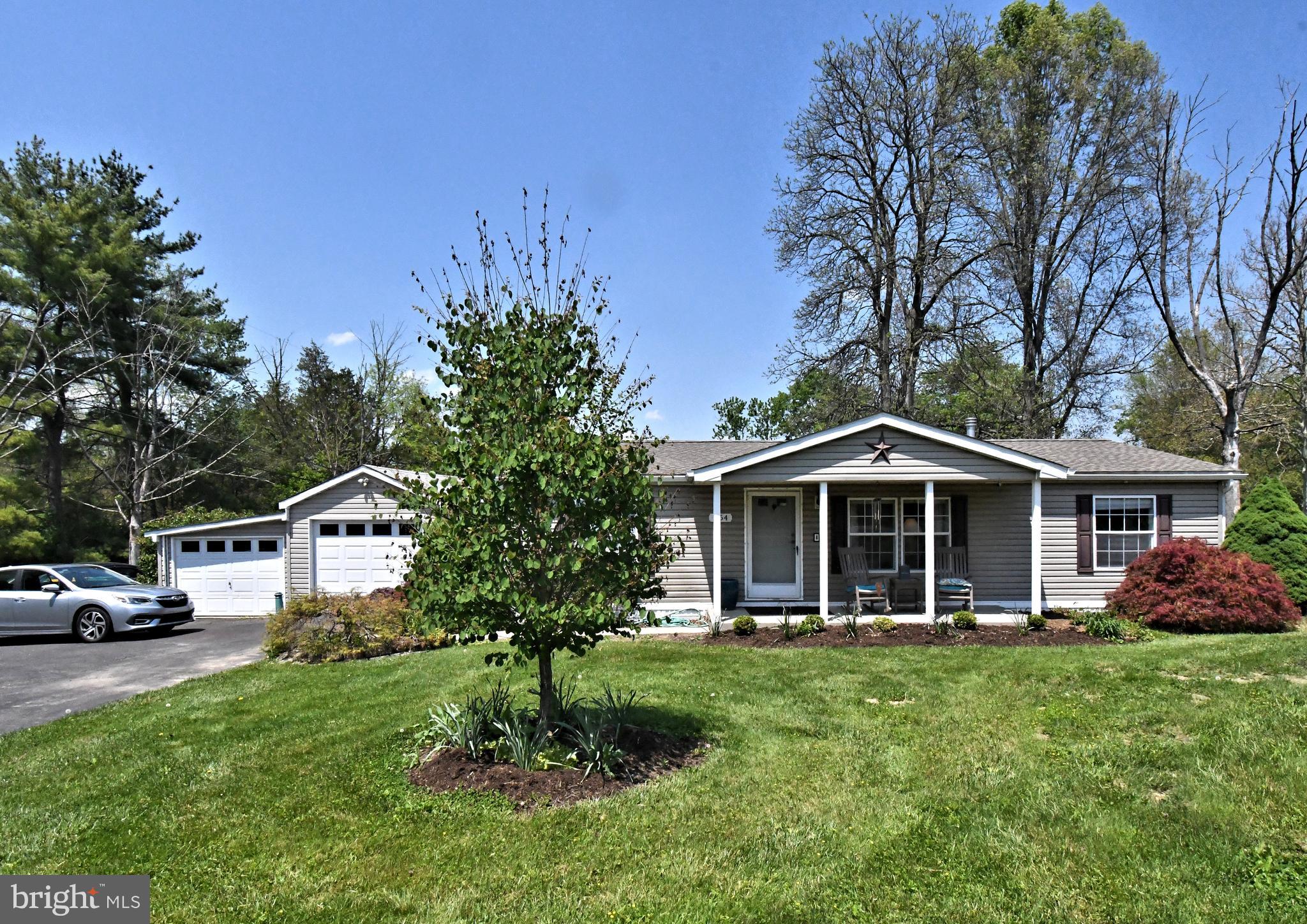 Welcome home to this well-maintained ranch-style home in Bucks County! Inside, the open layout creates an easy flow between the kitchen, dining area, and living room, making the home feel bright, welcoming, and connected. The living space is anchored by a cozy fireplace and natural light. Featuring 3 bedrooms and 2 full bathrooms, this home offers practical one-floor living in the Quakertown Community School District. Step outdoors to enjoy the spacious yard and shed for additional storage. With a covered front porch, detached garage, and location just minutes from shopping, dining, and commuter routes, 454 W Paletown Rd combines country charm with everyday convenience!