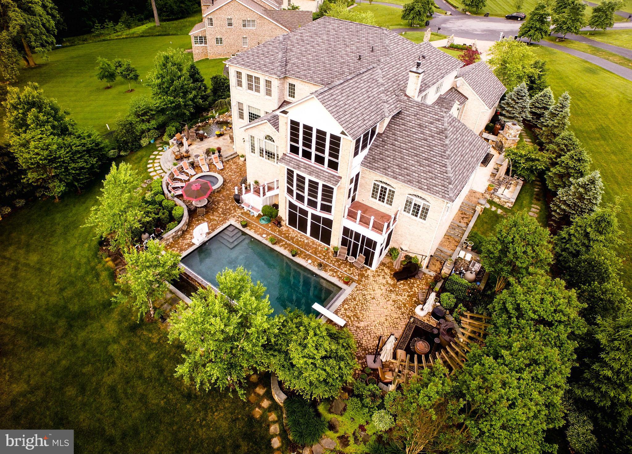 Luxury, Privacy, Beauty, this is the one! 6 BR, 7FB, 2HB. Bumpouts make this one of the biggest home in Patuxent Chase!  Brazilian Hardwood, Chefs Kitchen, 3 Fireplaces, Whole-house Surround Sound! Huge Master Suite!  Basement inc Wine Room, Custom Bar, Theatre, Sauna, Workout Room & LL Master Suite. Infinity Pool, Whirlpool, Pond w/ Waterfall, BBQ area w/ Viking Grill. Fenced Yard backs to Woods.