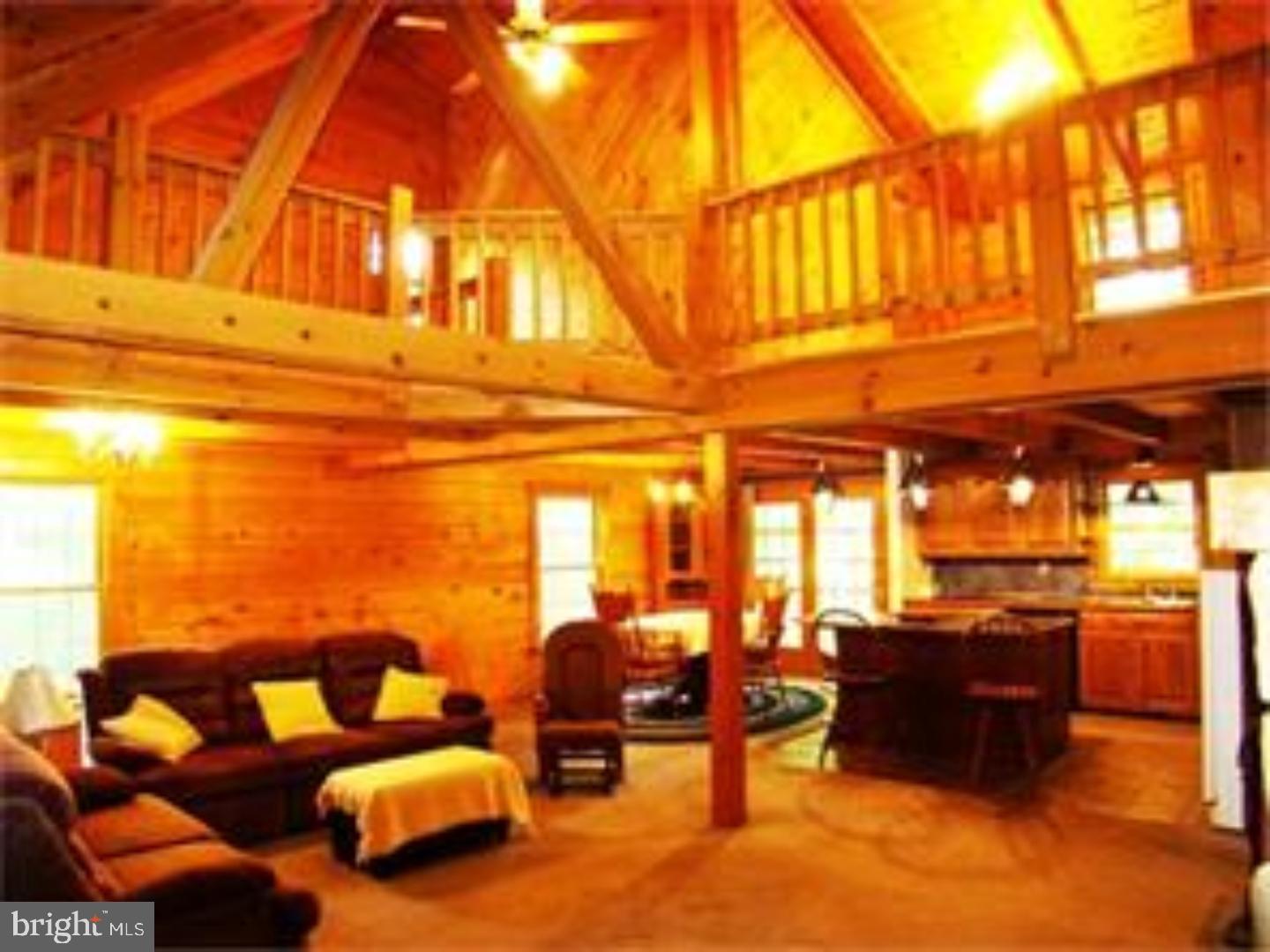Beautiful Custom-built Log Cabin now available in Conrad Weiser school district, spacious at 2800 sq. ft and just down the road from a State Forest! This is a lovely Cape Cod with four bedrooms, three full baths and three stories. Stone piers with lights and gates open to a drive leading to this gorgeous home nestled on 2 wooded acres on Texter Mountain in Robesonia ? secluded yet convenient to everything. From the huge 44 ft. covered porch and 20 ft. wide covered deck out back surrounded by forest, to the fabulous living room/Great Room with vaulted 2-story ceiling, bay window, loft overlook and massive 2-story stone fireplace (for those snowy winter evenings), to the open-plan kitchen with massive island and dining area, this is the log home of your dreams. On the main floor there's a spacious first-floor bedroom as well as a comfortable spacious library/den, while up the stairs there's the huge loft and a separate sitting area overlooking the Great Room. The Master suite is also on the grand scale, with a vaulted ceiling, his and hers closets and a balcony that overlooks the peaceful wooded lot. On the lower level (with additional square footage not included in total above) you can enjoy the Recreation/family room, and there's even another bedroom and full bathroom down here as a bonus, plus the access to the two-car oversized garage with plenty of extra room. Full bathroom on every level! There's ALSO a generator included and the house is pre-wired for back-up power, while the huge stone fireplace has a 30,000 BTU heatalator grate which can heat almost the whole house in an emergency. Seller will even pay for Home Warranty for buyers' peace of mind.