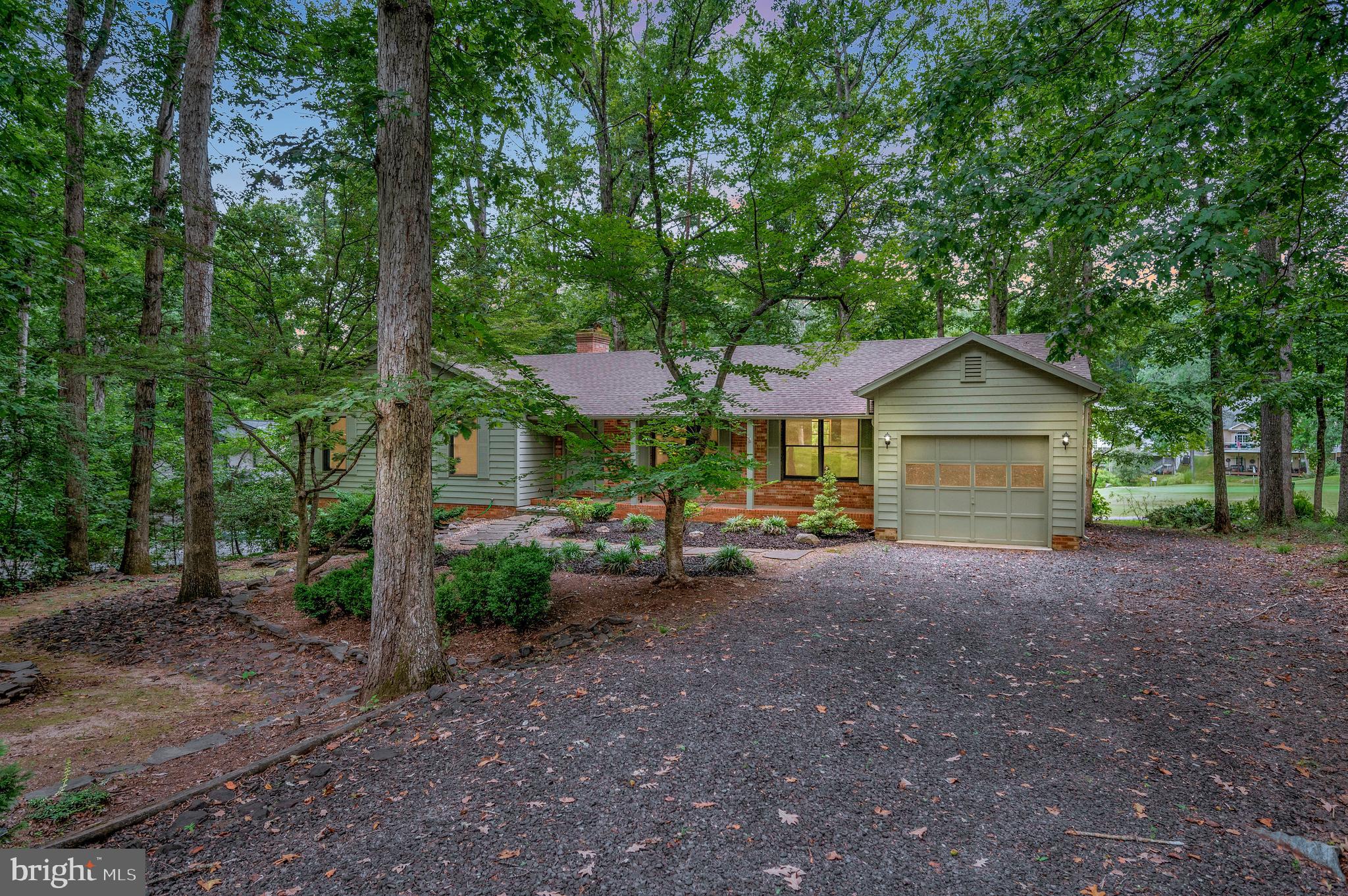 Discover comfort, style, and incredible views in this 3,378 sq. ft. home, perfectly positioned to capture both golf course and pond views of the 14th green. With a yard designed for low-maintenance living, this property offers abundant space and potential for your personal touch. Step into an inviting foyer with so much room to greet your guests that it sets the tone for the home’s warm and welcoming feel. To the right, a formal living room offers an elegant space. The open family room features a stunning floor-to-ceiling brick fireplace with built-ins, seamlessly connecting to the fabulous kitchen—complete with generous granite counter space, stately cabinetry, abundant storage, and access to the eating area. Skylights and expansive windows fill the home with natural light, creating a bright and airy atmosphere. The main level also hosts the primary suite and two guest bedrooms, and a guest bath for convenient single-level living. The fully finished lower level offers endless possibilities, along with a wet bar. You’ll find a second family room/den complete with a wood stove that opens to a private patio, perfect for enjoying the outdoors. A spacious rec room with a sizable wet bar and pantry is ideal for entertaining. This level also includes the fourth bedroom with an attached bath, multiple additional rooms, and a laundry room. With its prime location, low-maintenance yard, and spacious, light-filled interior, this home is a rare opportunity to enjoy golf course and lake living at its finest.

Nestled in a private, secure, gated community, Lake of the Woods is a paradise of possibilities. With two lakes, a golf course, an equestrian center, fire and rescue services, and even a church within its bounds, this community offers a diverse range of activities. From boating, water skiing, kayaking, and golfing to the simple joy of soaking in mesmerizing views from the clubhouse, deck, yard, or beaches, there's something for everyone. Engage your interests by joining over 60 clubs and organizations, or perhaps indulge in a game of bridge or contribute your talents as a volunteer. Lake of the Woods truly caters to your lifestyle.

Located in Orange County, enjoy the added advantage of low real estate taxes. With home prices spanning from $200,000+ to over $2,000,000, Lake of the Woods is the ideal haven for both full-time residents and weekenders. Don't just take my word for it – come and see for yourself! Allow me to guide you through a tour of Lake of the Woods, showcasing the very essence of what makes this community so special. Experience firsthand the captivating charm of Lake of the Woods!