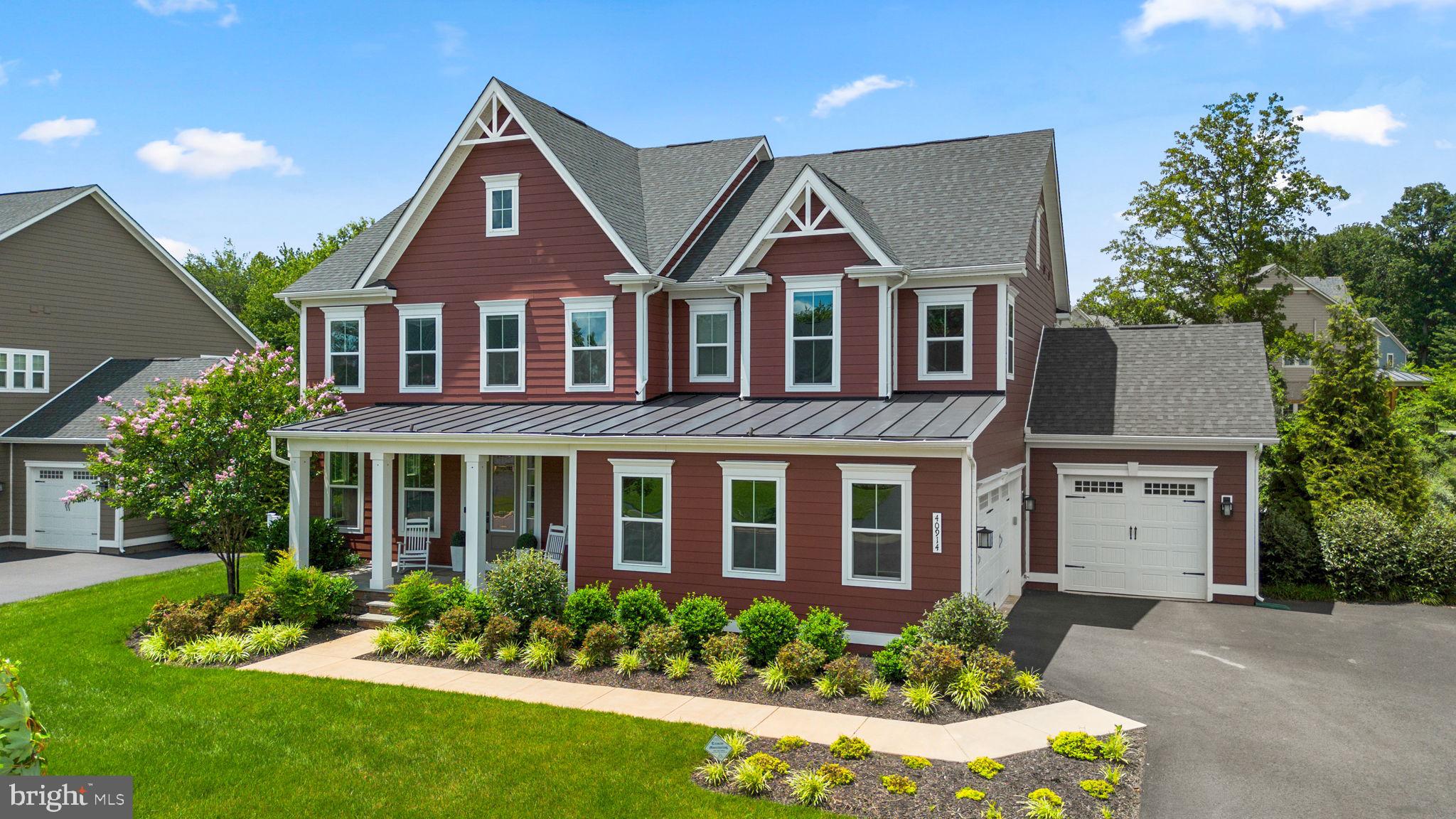 Nestled on a premium corner lot backing to woods in award-winning Willowsford community, this beautifully maintained single-family home offers the perfect blend of luxury, comfort, and community.  Thoughtfully designed and impeccably maintained, the home showcases elegant finishes, abundant natural light, and a highly desirable open-concept floor plan. 

At the heart of the home is a stunning gourmet kitchen featuring an oversized quartz center island, double wall ovens, stainless steel appliances, a gas cooktop, extensive white cabinetry, and generous prep space. Seamlessly connected to the spacious family room and dining area, this inviting space is ideal for both everyday living and entertaining.  Expansive windows frame serene wooded views and  flood the home with natural light, while the adjacent dining area provides an inviting setting for family meals and special occasions. 

The main level also features a private home office or flex room, a functional mudroom, and access to the screened porch overlooking the tranquil tree-lined backyard. Whether enjoying a quiet morning coffee or hosting friends and family, the screened porch and private wooded setting create a seamless indoor-outdoor living experience rarely found in today's market.

The upper level features four generously sized bedrooms, including a luxurious primary suite with two walk-in closets and a spa-inspired bath. One secondary bedroom includes a private en-suite bath, while two additional bedrooms share a Jack-and-Jill bathroom, offering an ideal layout for family and guests.

The fully finished walk-up lower level expands the home's living space with a spacious  recreation room, private bedroom, full bath, and direct access to the backyard—perfect for guests, a home gym, or media room. This versatile level provides endless possibilities to fit your lifestyle.

Additional highlights include wide-plank luxury flooring, designer lighting, a whole-home speaker system, remote-controlled shades, extensive storage, front and rear irrigation, exterior accent lighting,  and an  oversized  3-car garage. 

Beyond the home itself, residents enjoy unparalleled access to Willowsford's exceptional amenities. Located within walking distance of Willow Grove Pond and Splash Park, the community offers pools, fitness centers, miles of scenic trails, parks, playgrounds, community farm, fishing ponds, and vibrant calendar of year-round events. Conveniently situated near top-rated schools, shopping, dining, wineries, and major commuter routes, this remarkable property presents a rare opportunity to own a private wooded home on one of Willowsford's most desirable homesites while enjoying the very best of Northern Virginia living.