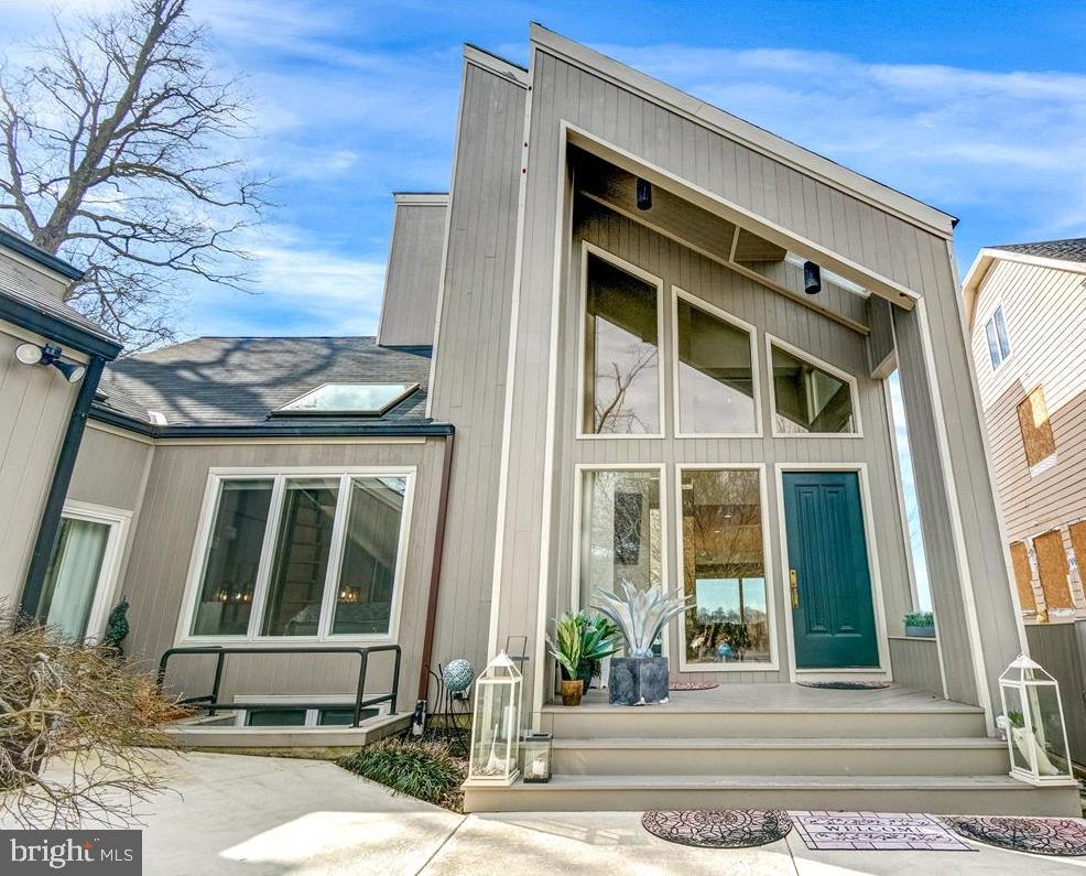 New On Market!  Outstanding  South River waterfront in popular Cape St. John community with private pier, 2 - boat lifts (1-10,000 lb power boat and 1-15,000 lb sailboat),  newly constructed sun deck at pier level, secure storage. This is a contemporary home with soaring ceilings and walls of glass to take in the stunning views. Master Bedroom Suite on 2nd Level has huge water views, gas fireplace, luxury bath with walk-in shower and sunken tub,  private sitting room with wet bar, large walk-in closet and staircase up to loft area above with bonus room and full bath. There is a Main Level guest bedroom off Foyer with fun sleeping loft and is serviced by Full Bath off hall way. A 3rd Bedroom/Suite area is accessible off Kitchen wing which has additional private entrance/exit off Mud Room and features a small kitchenette w wet bar, full bath w laundry facilities.  Full Basement with 4th Full Bath w shower stall and storage. Gorgeous in-ground pool overlooking the river with views of bridge and Mike's Crab House features jacuzzi and resistance swimming feature, winter pool cover on now and has new retractable summer cover. Large 33 x 64 deck for great for entertaining with built-in outdoor gas grill. Nicely landscaped. This is truly a one of a kind property! Conveniently located off Riva Rd corridor with excellent access to Rt. 50, Parole Centre and only 10 minutes to downtown.