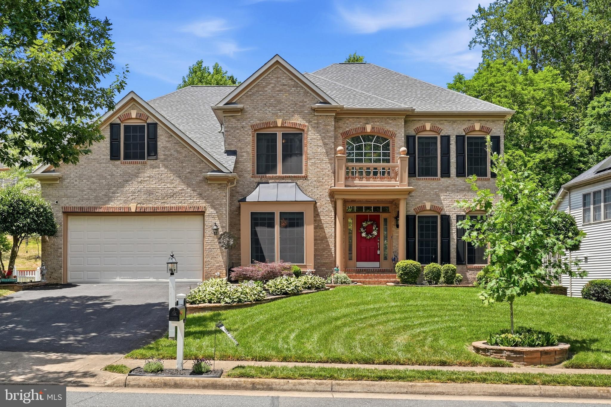 Welcome Home to this exceptional NVHomes Carters Grove model located in the highly desirable Powells Landing community. This beautifully upgraded residence offers luxury, space, and convenience in one of Northern Virginia’s most accessible commuter corridors.  Step inside to a grand two-story foyer and dramatic two-story family room filled with natural light. The main level features hardwood floors throughout and an open, flowing layout ideal for both entertaining and everyday living. The gourmet kitchen includes an extended center island, granite countertops, custom tiled backsplash, abundant cabinetry, and a brand-new refrigerator (2026).  Upstairs, the expansive primary suite is a true retreat with custom crown molding and an electric fireplace with remote control. The upper level includes four spacious bedrooms and four and a half bathrooms, including a beautifully customized powder room.  The fully finished lower level offers exceptional entertainment space with a large recreation room, dedicated media room/guest bedroom, wet bar, fireplace, and full bathroom—perfect for guests, gatherings, or multi-generational living.  This home has been thoughtfully enhanced with extensive upgrades, including: new architectural shingle roof (2022),  HVAC systems replaced (2022), custom darkened window screens, pull-down attic ladder and two attic exhaust fans, custom tile flooring and built-in shelving in the garage, hardwood flooring throughout main level.   Outdoor living is a standout feature of the property, offering a private backyard retreat with a custom patio, pergola, and stairs, enhanced by professional landscaping, custom brickwork around the home, paver retaining walls for planting beds, and landscape uplighting. A large outdoor shed adds valuable storage and functionality.  Location is unbeatable—situated in Woodbridge, this home offers convenient access to a wide array of Northern Virginia amenities. Nearby destinations include the waterfront dining and shopping of Occoquan Historic District, and outdoor recreation at Leesylvania State Park along the Potomac River. Nature lovers will also appreciate proximity to Prince William Forest Park and the protected wetlands of Occoquan Bay National Wildlife Refuge.  For shopping, dining, and entertainment, residents enjoy quick access to Potomac Mills, one of the region’s premier retail destinations, as well as the newly developed Quartz District, offering additional dining, retail, and lifestyle conveniences. Commuters benefit from convenient routes to major employment centers, including nearby military installations such as Marine Corps Base Quantico.. Commuters benefit from convenient routes to major employment centers, including nearby military installations such as Marine Corps Base Quantico.  With its extensive upgrades, premium finishes, and exceptional location near parks, marinas, shopping, and major commuter routes, this home offers the perfect balance of luxury living and everyday convenience.  ***OPEN HOUSE: Sunday, June 21, 2026, from 1:00 PM to 4:00 PM.