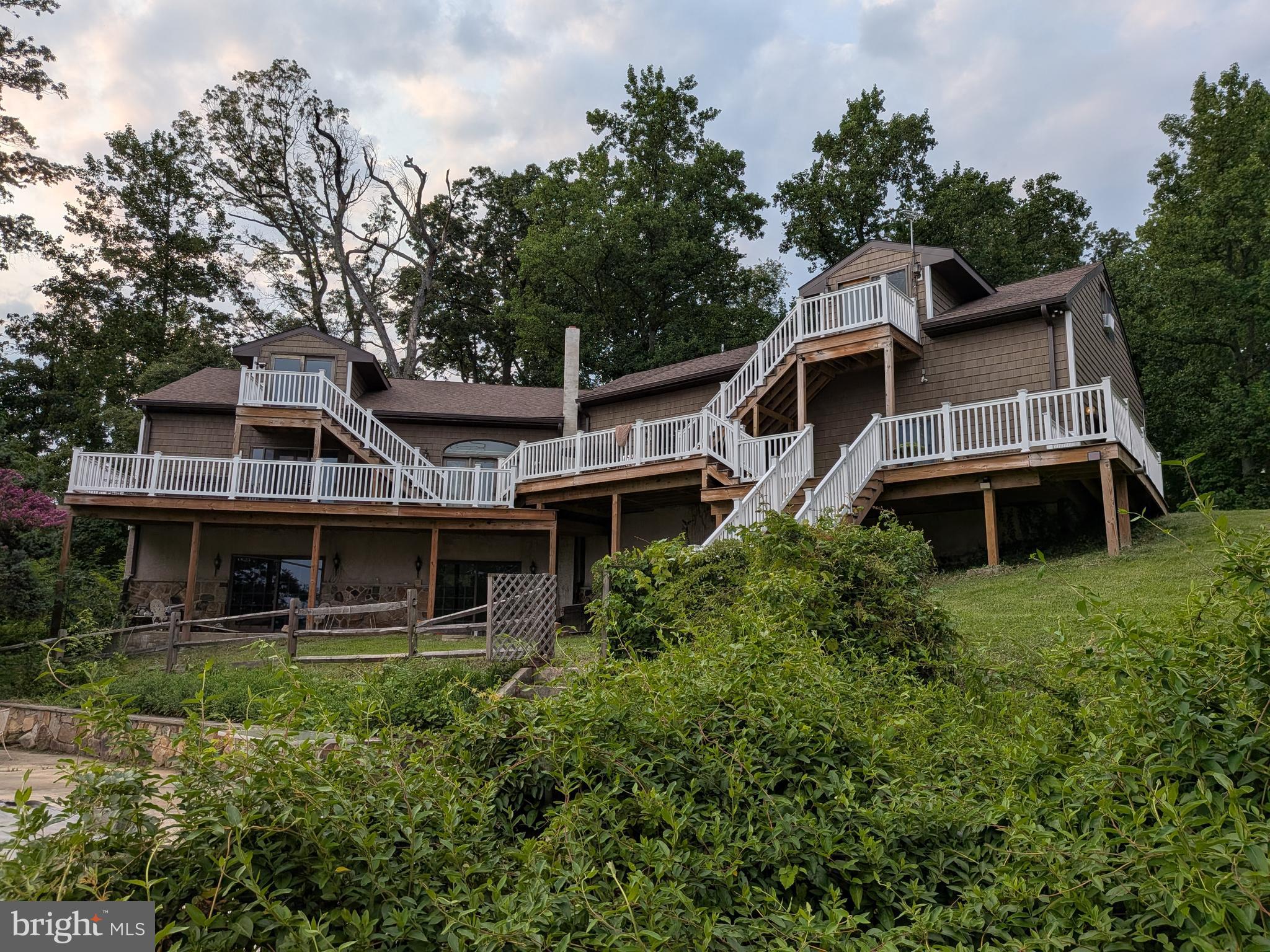 This waterfront property offers incredible potential and a rare opportunity to create something truly special. The home experienced storm damage several years ago, and while significant improvements have already been completed, the property is still in the process of being renovated and will require additional work to finish.
Recent updates include all new windows, new siding, a new roof, a new dishwasher, and a newly built deck. The basement has been completely gutted and is ready to be finished.
The home offers a spacious layout with unique features, including a primary bedroom with a loft and sliding glass doors that open to the deck, providing beautiful natural light and a relaxing connection to the outdoors.
Another standout feature is the separate above-garage apartment/in-law suite, which includes a bedroom, bathroom, mini-kitchen, and private entrance, offering great potential for guests, extended family, or additional living space.
The property also includes both an attached garage and a large detached garage, providing plenty of storage, parking, and workspace.
Situated on 3.12 private acres along the water, the setting is truly the highlight—offering peaceful views, privacy, and plenty of space to make this property your own.
The seller is unable to complete the remaining renovations, and the property is being sold in its current condition. With vision and finishing touches, this home could be transformed into an exceptional waterfront retreat.