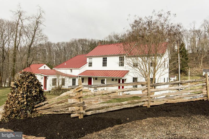 1800's charming country farmhouse that is sure to WOW! Spectacular LR with stone FP, large DR, comfy & light filled country kitchen, den, library, mudroom and first floor laundry...random width floors, MBR/MBA/Sun room addition, AMAZING barn with 3 car garage, workshop, tool bench, shelving & potential office/gym space, or party barn. MUST SEE!