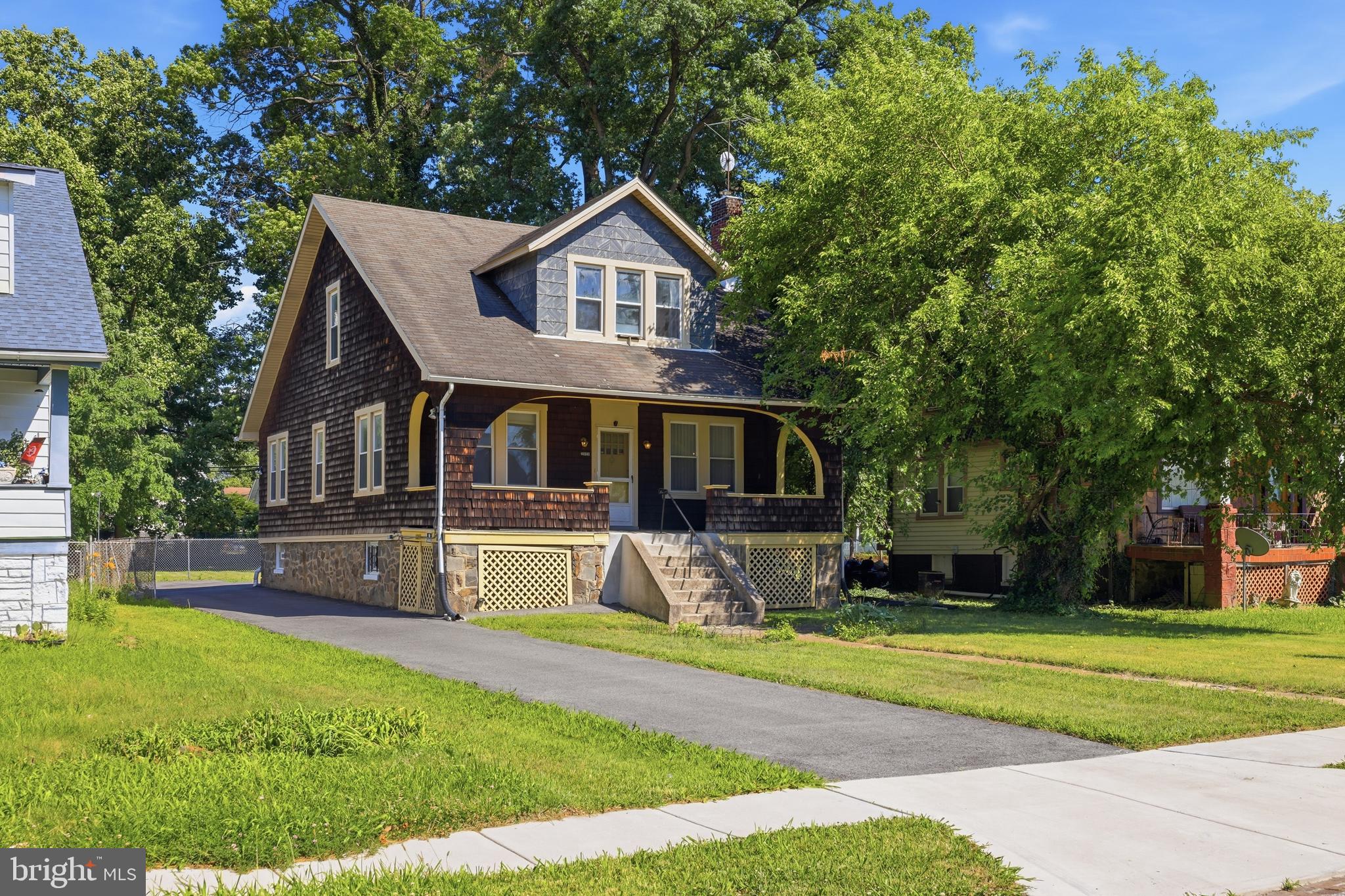 Amazing opportunity to own a well-maintained Cape Cod multi-unit home with cedar shingles; a true Baltimore classic featuring a huge fully fenced backyard and abundant parking with 3 true, separately metered units, each having a separate entrance. You could live in the home as a single-family residence with 4 BR and 2 BA, live in one unit and rent out the other, or rent each unit separately. This home has been lovingly maintained and updated over the years. Built on a stone foundation, it is a solid home with updated windows, hardwoods throughout, a wood-burning fireplace, gas heat, 2 boilers making hot water baseboard heat, and two sump pumps. The second sump pump is located behind the refrigerator in the basement. The main-level unit is a 2 BR, 1 full bath with LR, DR, and KIT. The 2nd unit, Upper 1, offers 2 BR with walk-in closets, 1 full bath, LR, DR, and KIT. The lower level has laundry, utilities, abundant storage space, and is heated. The basement could also stand on its own as an efficiency with a kitchenette including a stove, sink, and refrigerator in one unit, plus a full bathroom with shower, toilet, sink, and heat. PROFESSIONAL PHOTOS COMING SOON!