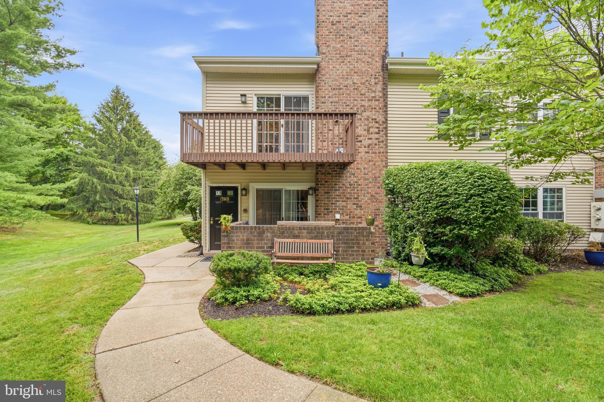 Two bedroom, two bathroom end unit condo in Heacock Meadows.  This condo features an open floor plan with vinyl plank floors throughout, brick wood burning fireplace and patio. The kitchen has a cut out allowing sight lines into the living room.  A full walk in pantry has plenty of room for food items, storage and washer/dryer.  The primary bedroom is large and can fit a king sized bed easily, two closets and a primary bath with stall shower.  The secondary bedroom in nicely sized and a full hall bath is perfect for guests.  The HOA just redid the roof/siding/shutters and gutters in 2026. A cozy brick enclosed patio is accessible from the living room.  Enjoy walking through the neighborhood. Great location; walk to Giant, DeLorenzo's Tomato Pies, restaurants and stores. Close to major roadways; can get to NY, Phila and the beach within an hour.  Pennsbury School District.