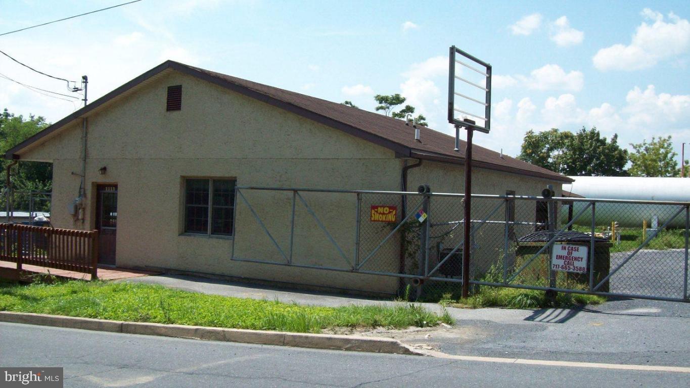 Great space for a contractor's office with a garage for storage plus a loading dock. Tenant pays only utility costs.