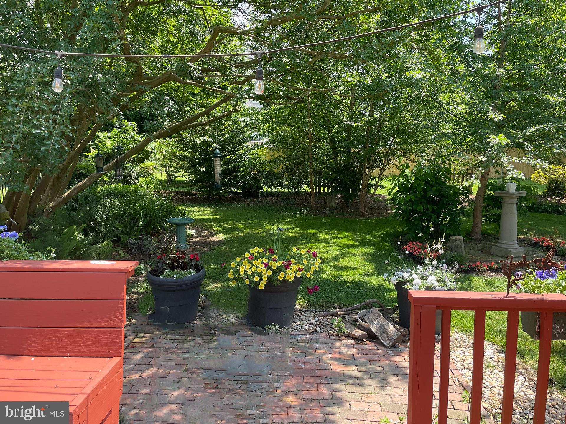 Welcome to 308 Glenburn!  This  is a  classically-designed 2,284 SF house surrounded by a multitude of glorious lush gardens on .26 of an acre!  308 is a lovely 4 bedroom, 2.5 bath home, served by central air conditioning and brand new windows throughout.  308 showcases a beautiful sunny living room with a charming wood-burning fireplace and a  great screened-in porch just off the living room.  Additionally, the house offers a gracious dining room with a cozy den/office located just off the dining room.   The inviting updated kitchen is large and well laid out with great appliances and  a sunny bonus/office room behind  the kitchen, which leads to the back yard.  Thee laundry room is located conveniently just off the kitchen.  
The second floor boasts 4 well-sized bedrooms and 2 updated bathrooms.  The third floor is reached by built-in steps and has great potential for 
serving as additional living space if desired.  Additionally, the house has a spacious attached 2-car garage with new remotely-controlled garage  doors.  The back yard hosts a large, useful garden shed sited amongst beautiful gardens.  This beautiful classic house is located on a wide gracious street in Cambridge, just a few blocks from the banks of the mighty Choptank River and the Cambridge Yacht Club.   If walkability to downtown restaurants and shops  is of interest to you this is the ideal location.  Please  consider  joining in the ongoing renaissance taking place in Cambridge, MD!