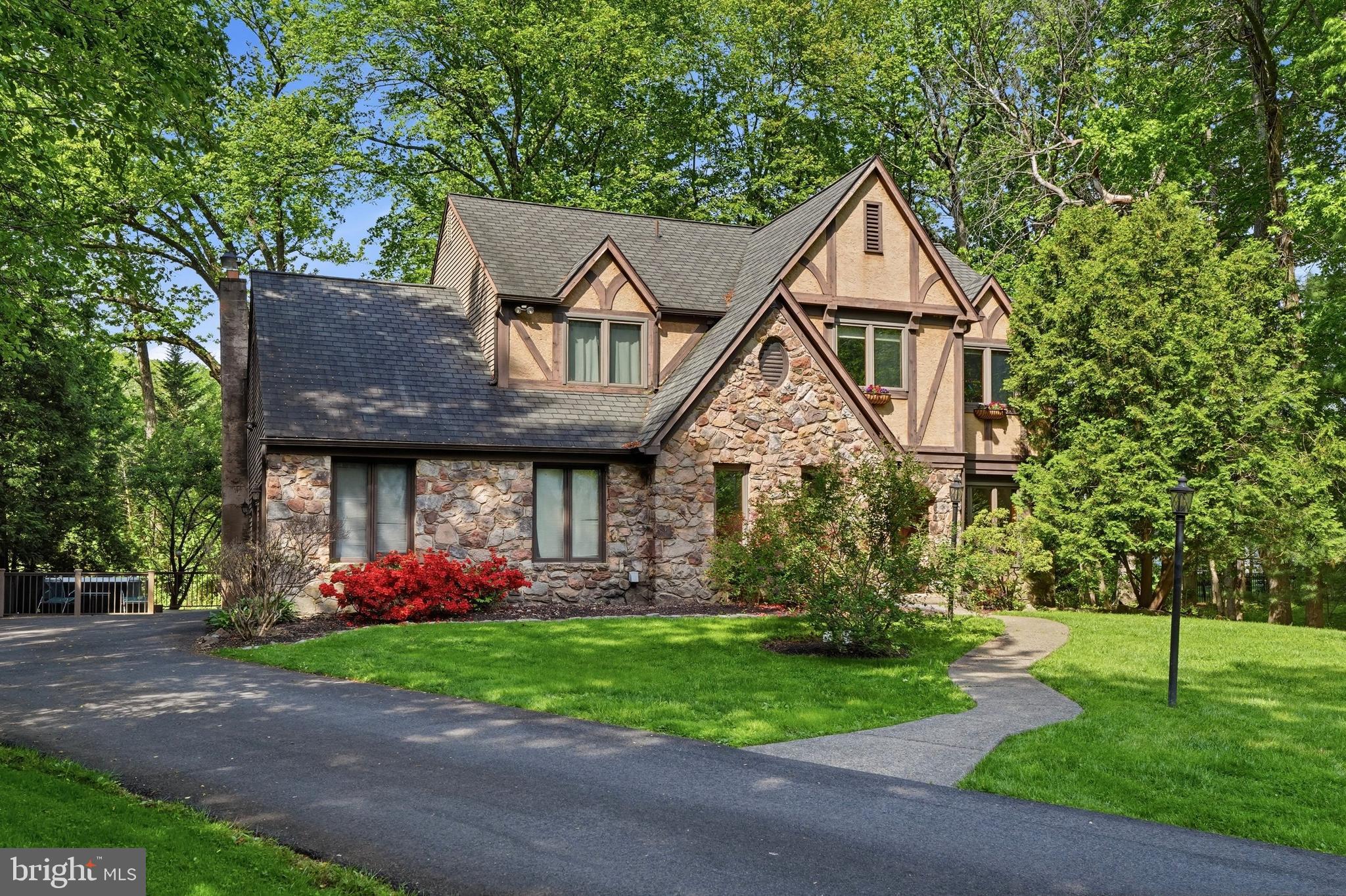 Welcome to 24 Berkley Drive, a fabulous 4-Bedroom 2.5-Bath Tudor in one of the area's most desirable neighborhoods.  Perfectly situated on a quiet cul-de-sac, this home offers the ideal blend of privacy, convenience, and neighborhood charm.  Step inside to discover beautiful hardwood floors, abundant windows, and an open light-filled layout designed for comfortable everyday living and entertaining.  The spacious kitchen is a standout feature, showcasing gorgeous Cambria quartz countertops, a propane gas cooktop, modern finishes and plenty of space for gathering.  The kitchen flows seamlessly into the inviting family room, complete with a cozy wood burning fireplace - ideal for relaxing evenings at home.  Upstairs, you will find 4 nice sized bedrooms with ample closet space and ceiling fans as well as 2 full updated bathrooms.  The finished basement offers flexible living space perfect for a rec room, home office,  playroom, or home exercise space.   Outdoor living shines newer composite deck (2023), creating the perfect setting for entertaining, dining outdoors, or enjoying quiet evenings in the hot tub!  Additional major improvements include a new roof (2018) and brand-new siding (2025), offering peace of mind for years to come.  A large garage, attic, and numerous thoughtful upgrades further enhance this move in  ready home.  Located in a highly desirable neighborhood within the sought after Pennsbury SD, this home combines timeless charm with modern updates in a sought after location.  Opportunities like this are rare -  so don't miss out!  Open House Sunday May 31 from 1-3 PM!
