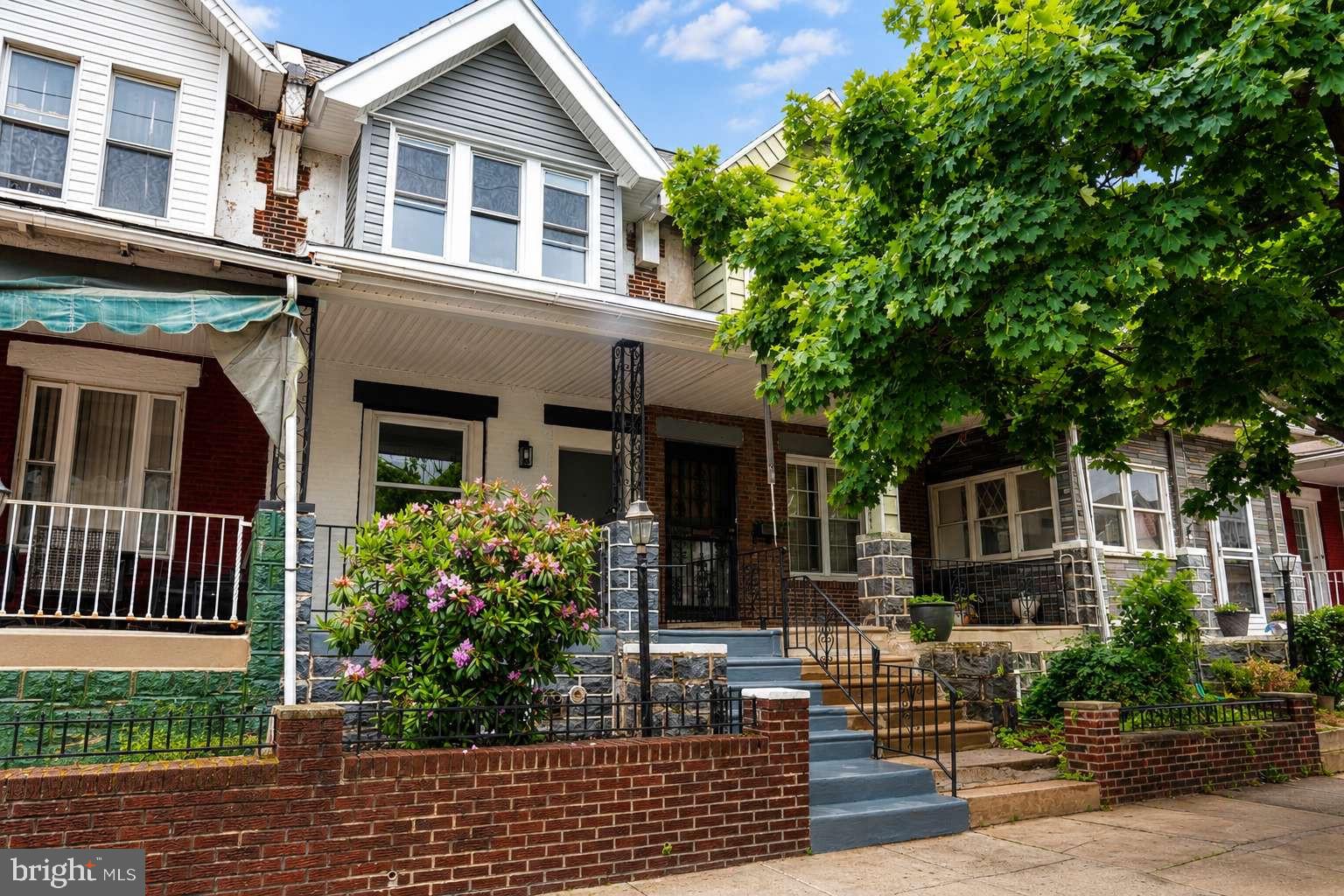Welcome to 719 S 59th Street, a beautifully renovated bright 3 bed, 2 bath rowhouse in the desirable part of cobbs creek in West Philadelphia. The modern kitchen offers white and oak cabinets with granite countertop, island and contemporary marble backsplash. House comes with all new stainless steel Samsung appliances and Samsung washer and dryer. Fully new plumbing and electrical work done to the entire house. New HVAC system has been installed with 2 years labor and 10 years parts warranty. Bathrooms is completely renovated with bright skylight, standing shower, contemporary tile work and modern fixtures. Semi finished basement has new concrete and mason work done. House has beautiful front porch and a cozy backyard with fence and new brick wall.