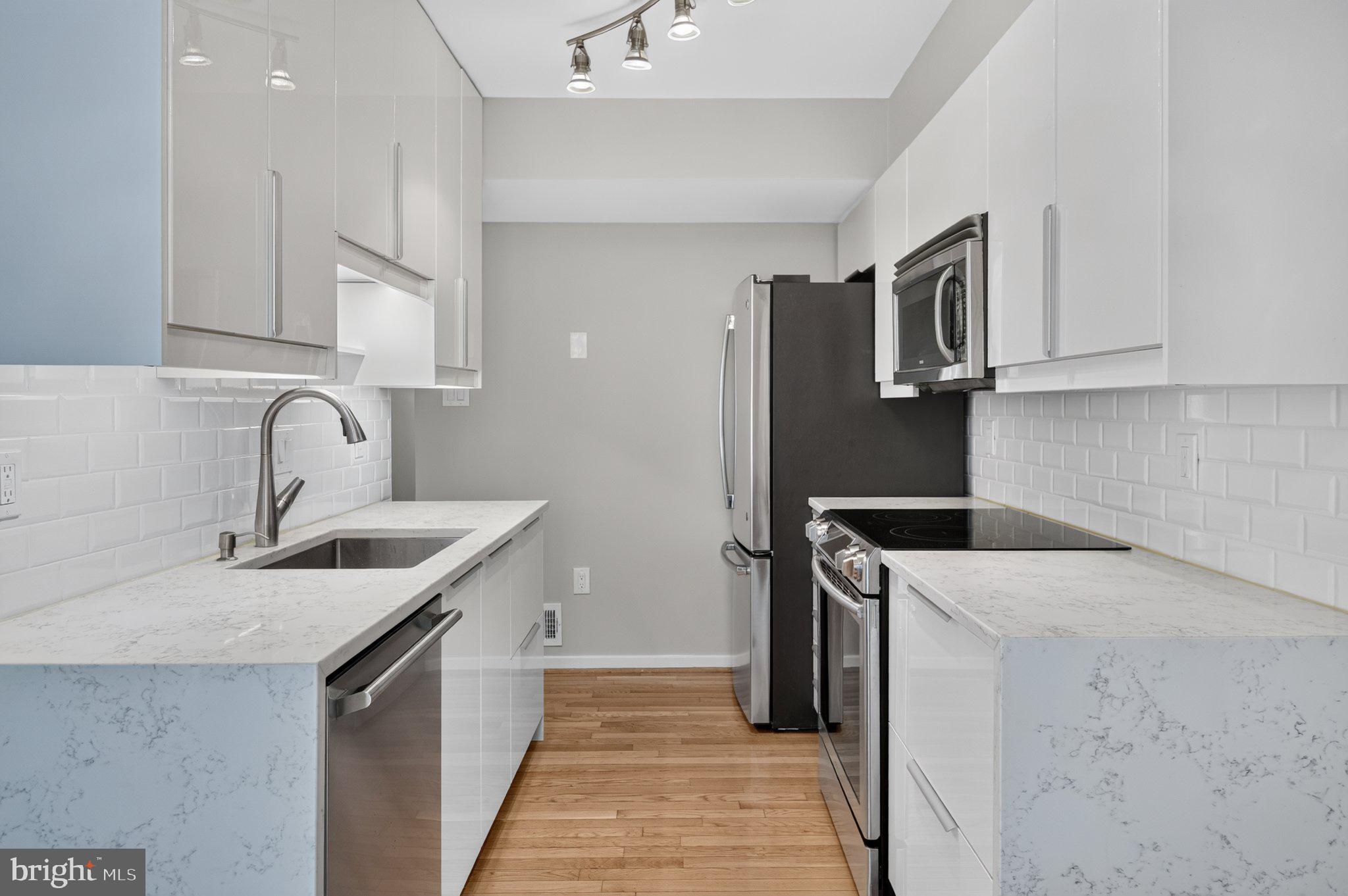 Discover the charm of this contemporary townhouse nestled in the desirable Millrace community. With three spacious bedrooms and three and a half bathrooms, this home is designed for comfort and functionality. Enjoy upgraded modern kitchen boasting beautiful stone countertops and stainless steel appliances, including a built-in microwave and dishwasher, ensuring your culinary adventures are a delight. The inviting hardwood floors flow throughout the main living areas, while the fully finished basement offers additional space for relaxation or recreation. A cozy brick corner fireplace adds warmth and character, creating a perfect spot for unwinding after a long day. Step outside to your private deck, ideal for morning coffee or evening gatherings, all while enjoying the serene views of the garden and lawn. This home is equipped with solar panels, offering added energy efficiency and potential savings on utility costs. Located on a cul-de-sac, this home offers a sense of community and tranquility. With convenient off-street parking, including a garage and driveway space, you'll have easy access to your home. The community amenities, including a refreshing outdoor pool, enhance your lifestyle, making it easy to enjoy leisure time. The entire home has been freshly repainted, creating a clean and lively atmosphere This well-maintained residence is ready to welcome you home. Enjoy all the amenities Montgomery Village has to offer, including community swimming pools, scenic lake trails, parks, and playgrounds. Conveniently located within walking distance to the MC Public Library and just minutes from supermarkets, shopping, dining, I-270, and ICC-200 for an easy commute. Don’t miss this great opportunity. Experience the perfect blend of comfort, style, and community living in Millrace!