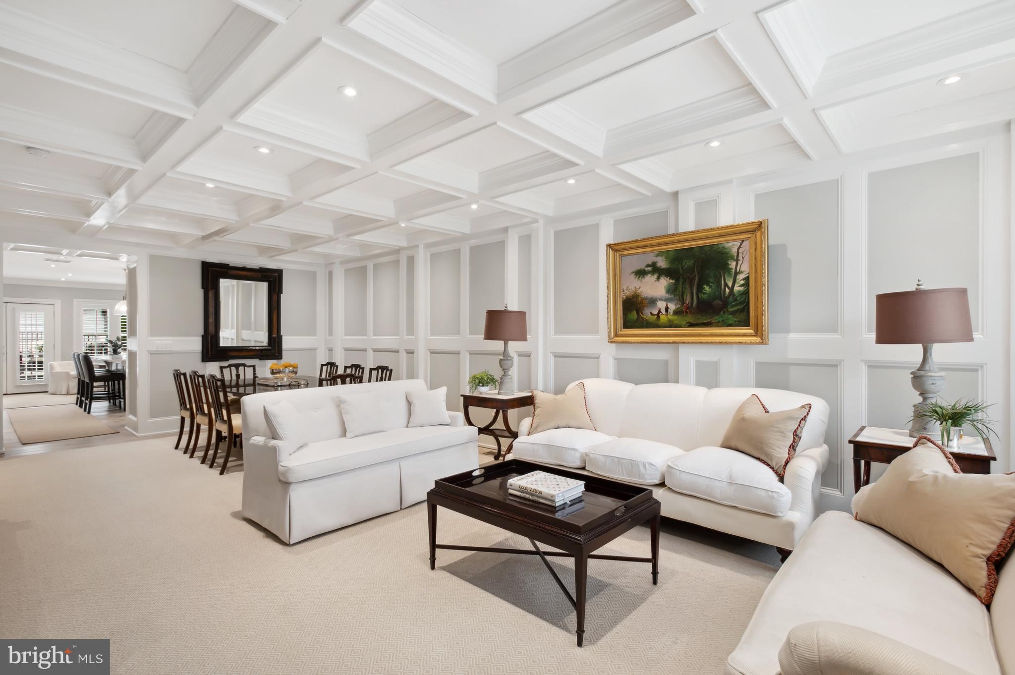 Open House this Sun (3/23) 1-3pm.

Completely rebuilt in 2023, this Georgetown-inspired townhome is filled with high-end finishes, a sophisticated design and spacious entertaining areas.  Developer Erick Cedron is passionate about quality and fine details. This stunning home features coffered ceilings and paneled walls on the main level, complemented by unique molding and plantation shutters that flow throughout. The expansive living room offers an open-concept layout, seamlessly connecting to the dining room which can easily seat twelve. At the rear of the main level, the high-end kitchen is equipped with Signature Kitchen Suite appliances, a central island, and luxurious quartz countertops. The kitchen also includes a convenient powder room and ample pantry space. Adjacent to the kitchen, a cozy sitting area with an electric fireplace flanked by built-in shelves leads to a elegant stone patio, perfect for outdoor entertaining.

Upstairs, the home includes two upper levels with four-bedroom suites, a laundry room with an in-unit LG washer and dryer, and a utility sink. The rear bedroom suites on each upper level open onto small balconies and feature walk-in closets. Both the bathrooms and laundry room are elegantly adorned with unique tilework. The front bedrooms offer generous closet space and large windows that fill the rooms with natural light. The third floor flex room can serve as a gym or office.

The lower level features a private guest suite with a flex space and kitchenette, complete with LG appliances, an additional laundry room with a sink, extensive closet space, and a rear bedroom that opens to the back stone patio.

Additional highlights include a private two-car parking pad with rolling garage doors, a Honeywell Pro Series alarm system, and adjustable Lutron lighting fixtures throughout. Located in Burleith, this home provides easy access to Georgetown’s vibrant shops and restaurants, MedStar Hospital, Duke Ellington School of the Arts, and Washington International School.