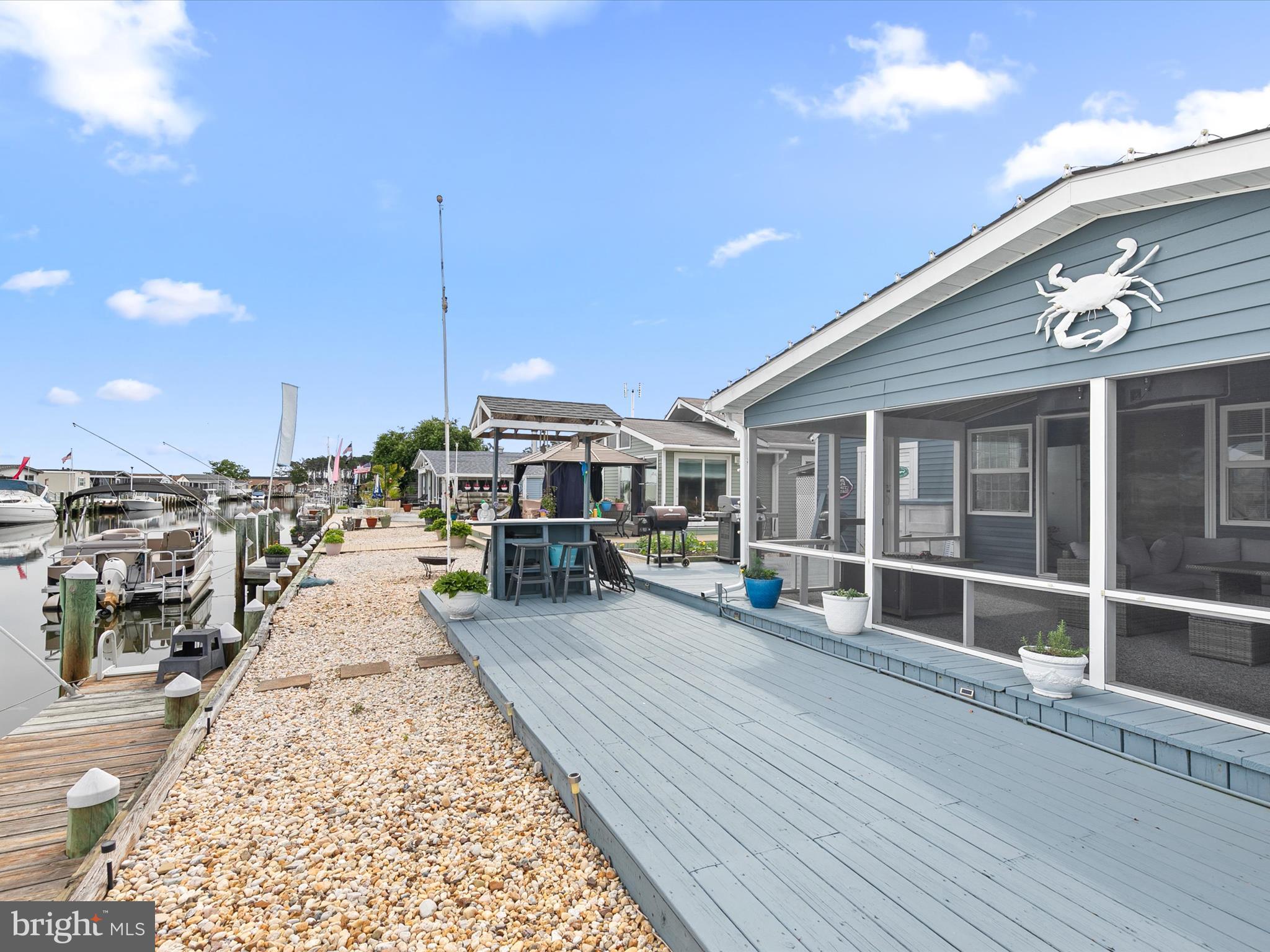 WATERFRONT. PRIVATE DOCK. $100K. — THIS IS YOUR MOMENT!

If you’ve been waiting for an affordable way to get on the water in Long Neck… this is it. And it’s not going to sit forever at this new price.

This beautifully maintained 2-bedroom, 1.5-bath modular home in Mariner’s Cove is officially being repositioned to $100,000 to get it SOLD. Not because something is wrong—because we need the right buyer to see the opportunity and act.

Let’s be clear:
- No known issues
- No smoke or pet odors
- Lovingly maintained
- Move-in ready

The only two factors holding buyers back have been:

Land rent: $1,764/month
Cash sale required (modular home—no DMV title, so no chattel financing)

If those two things work for you, this becomes one of the best waterfront values in Sussex County.

WHY THIS ONE STANDS OUT

Step outside and you’ll understand immediately.

Private dock + boat slip → be on Rehoboth Bay in minutes
Huge screened porch → easily the star of the home
Spacious deck + sunroom → water views from morning coffee to sunset
Coastal breezes that actually make you slow down and breathe

This isn’t just a house—it’s a place you’ll feeeeeel!

INSIDE: COMFORT WITH CHARACTER

Unlike many newer homes, this one has warmth and substance:

Inviting living room with a corner fireplace
Kitchen with extended counter seating for casual dining
Thoughtful layout that feels comfortable year-round—not just a weekend spot
BONUS SPACE + PEACE OF MIND
12x24 shed with electric, workbench & pegboard (perfect for hobbies, fishing gear, or a golf cart)
PVC & copper plumbing
Encapsulated crawlspace with sump pump & French drains
Years of careful upkeep
THE LIFESTYLE

Located in Long Neck, where everything is close:

Pool, clubhouse, pavilion, boat ramp in the community
Paradise Pub right across the street
 20-minute boat ride to Rusty Rudder
Shopping, dining, and daily needs just minutes away
REAL TALK

This home has been overlooked because people assume something must be wrong.

There isn’t.

It’s simply:

A modular home (not manufactured) → built like a traditional house
A cash-only purchase
A higher land rent than some buyers want

That’s it.

WHO THIS IS PERFECT FOR
Cash buyer who wants affordable waterfront living
Boater who values direct access over pretense
Someone who walks onto that porch and says, “Yep. This is it.”
ACT NOW

At $100,000, with this location, dock, and condition—this is no longer a “wait and think about it” property.

It’s a move before someone else does property.

If you’ve been trying to get on the water without spending $400K+, this is your window.