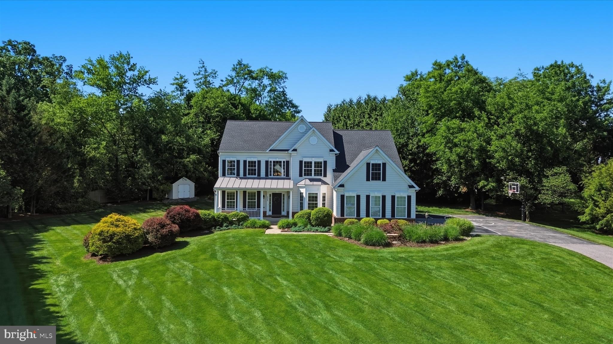 Welcome to 2348 Southfield Court, a stunning colonial located in the highly sought-after Highland View Estates neighborhood of Finksburg. Offering more than 4,500 square feet of beautifully finished living space, this exceptional home features 4 spacious bedrooms, 3 full baths, and 2 half baths, thoughtfully designed for both comfortable everyday living and elegant entertaining.
*Beautifully positioned on an impressive lot, the property offers exceptional curb appeal with mature landscaping, expansive exterior plantings, and a thoughtfully maintained setting that provides a wonderful sense of privacy. The home’s attractive exterior is complemented by lush greenery, well-designed outdoor spaces, and a separate storage shed that matches the siding of the home, offering both convenience and a cohesive, finished look. A large driveway provides ample parking and includes a basketball hoop, creating a fun and practical outdoor feature that is especially appealing for families.
*Step inside to a dramatic two-story foyer highlighted by dual staircases, creating an impressive first impression. The heart of the home is the gourmet kitchen, featuring granite countertops, custom-paneled appliances, a large center island, abundant workspace, and beautiful custom-paneled cabinetry and trim. The kitchen flows seamlessly into the inviting family room, where a cozy gas fireplace provides the perfect gathering place for family and friends.
*Additional everyday convenience can be found in the thoughtfully designed mudroom, which features custom built-in cabinetry for storage, organization, and a polished, functional entry point into the home.
*For those who work from home, the main-level private office offers custom built-in cabinetry and a quiet, productive workspace. Upstairs, the luxurious owner’s suite provides a private retreat, complete with a sitting area, spa-inspired en-suite bath with dual vanities, a walk-in shower, soaking tub, and generous walk-in closets with custom built-in cabinetry. Three additional bedrooms are also located on the upper level, including a private guest suite with its own full bath, while two additional bedrooms share a Jack-and-Jill bath.
*The finished lower level expands the home’s living space with endless possibilities. Enjoy movie nights in the dedicated media room with projector and screen, stay active in the home gym, and take advantage of the additional half bath and versatile bonus room that can be customized to meet your needs.
*Outside, discover your own private retreat. The expansive paver patio is perfect for entertaining or relaxing, with ample space for outdoor dining, built-in seating, and a cozy firepit—ideal for gathering with family and friends on cool evenings. Full landscape lighting enhances the patio and firepit area, creating a warm and inviting atmosphere for evening entertaining. Surrounded by extensive landscaping, the backyard offers a peaceful and private environment that elevates the home’s outdoor living experience.
*Over the past five years, the homeowner has made a number of meaningful improvements, including adding the expansive paver patio, installing a new roof, and completing fresh updates throughout the home. In 2026, new flooring and interior painting were completed throughout the home, and a new washer and dryer were also added, providing the next owner with both style and peace of mind.
*Combining timeless elegance, thoughtful updates, exceptional indoor and outdoor living spaces, attractive curb appeal, and an ideal location, this remarkable Highland View Estates home offers the luxury, comfort, privacy, and amenities today’s buyers are looking for. Come make 2348 Southfield Court your new home.