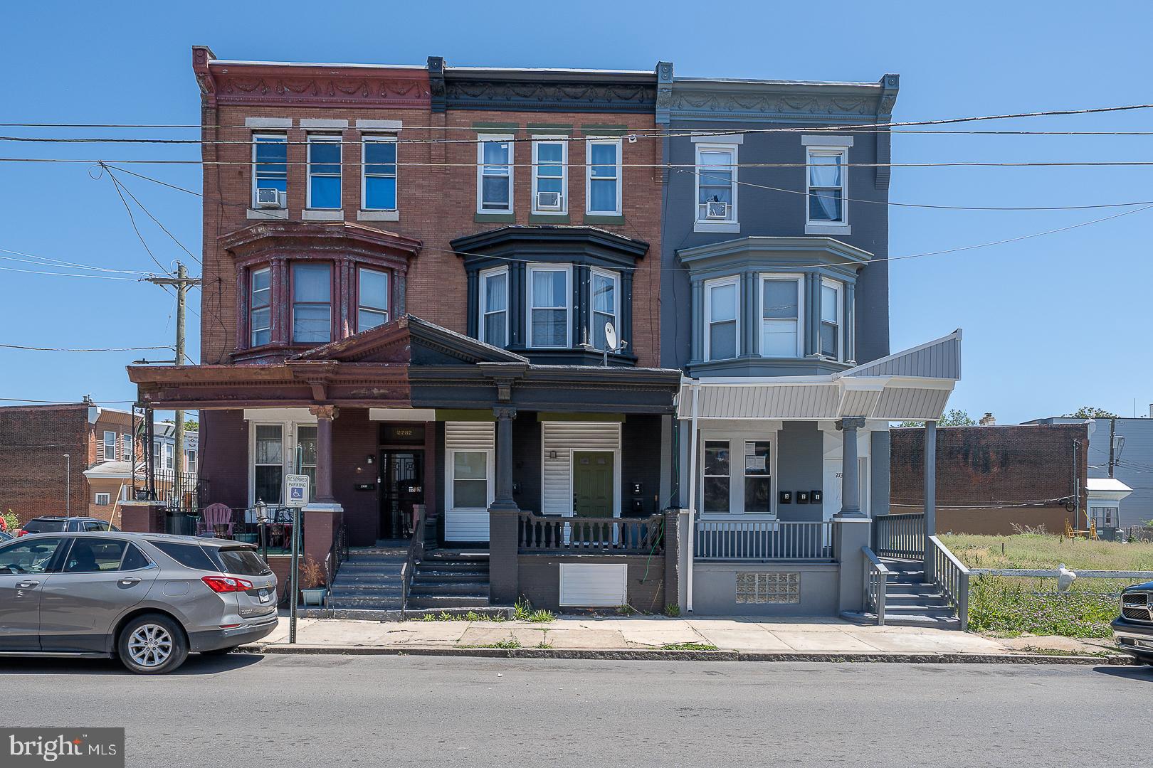 Fantastic renovated  triplex  with porch front! Features two 2-bedroom/1 bath apartments and a large 1 bedroom/1  bath apartment all with excellent layouts. This is an excellent investment opportunity!