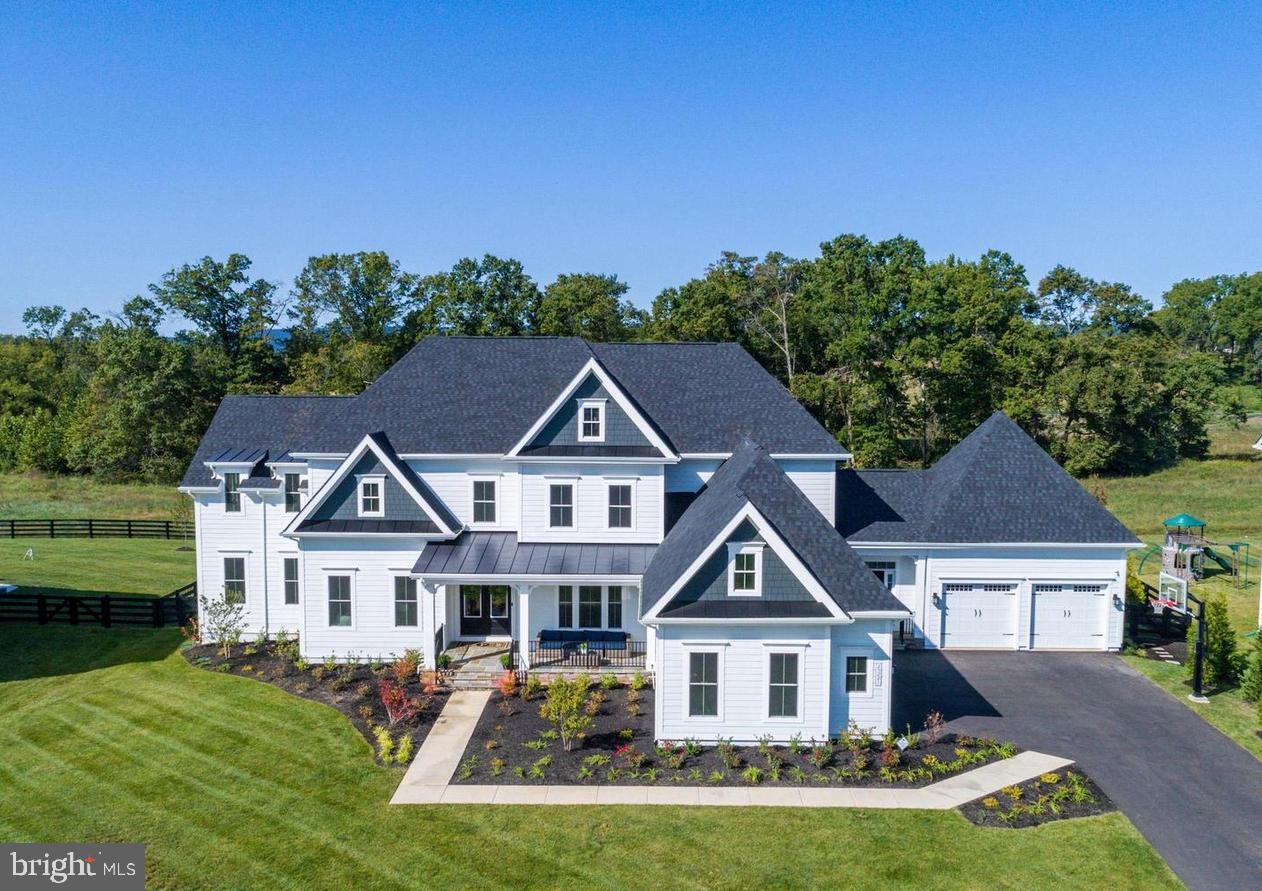 🌟 TRULY SPECTACULAR! 🌟 This fully expanded and meticulously upgraded Clifton Park II model by NV Homes is extraordinary! With over 9,000 square feet of unmatched luxury and sophisticated design, this home is crafted to complement and elevate your lifestyle.
🏡 The Heart of the Home
Step into the expansive kitchen—a chef's dream! With double kitchen islands, a cooktop with an in-wall faucet for pasta pots, and top-of-the-line GE Café professional appliances, this kitchen is built for family gatherings and unforgettable meals. A Sub-Zero built-in refrigerator takes it to the next level, making this space the hub of the home where everyone wants to be.
🌟 A Living Space That Inspires
The family room is a showstopper, with soaring windows that frame stunning views of the flat backyard, backed by the serene beauty of the Conservancy Willowsford property. The coffered trim ceiling and brick accent walls add a touch of timeless charm, while the bonus room above the family room is an ideal spot for remote learning or a creative studio.
💼 Work and Live in Style
The home office is tailor-made for telecommuters, offering a peaceful, productive environment. Need extra space? The main-level second master bedroom is a dream come true for multi-generational living or hosting visiting family and friends.
🛁 Owner's Retreat
The primary owner’s suite is pure indulgence! Hardwood floors, an exquisite spa bath with a stand-alone soaking tub, a two-person shower with dual heads, and upgraded vanities make this your sanctuary. Every bedroom in this home features a private ensuite bathroom and walk-in closet for unparalleled comfort.
🎉 Entertainment and More
The lower level is an entertainer's paradise, with a spacious wet bar, an open recreation area, and a home theater perfect for movie nights. A home gym, sixth bedroom, and fifth full bath complete the space—plus an additional powder room for your guests' convenience.
🚗 So Much Space!
A rare 5-car garage design, a fully fenced rear yard, and an in-ground irrigation system ensure this home is as practical as gorgeous.
📢 Don’t wait to make this dream home yours!  This is not just a house—it’s the perfect place to call home!
This home is located in the award-winning Willowsford Community, framed by the natural splendor of Loudoun's wine country. The resort-style amenities include community events, outdoor beach-entry swimming pools, a splash pad, a lodge, a fitness center, a lake, dog parks, tot lots, a sledding hill, and even a tree house! Don't miss the neighborhood farm stand/CSA.