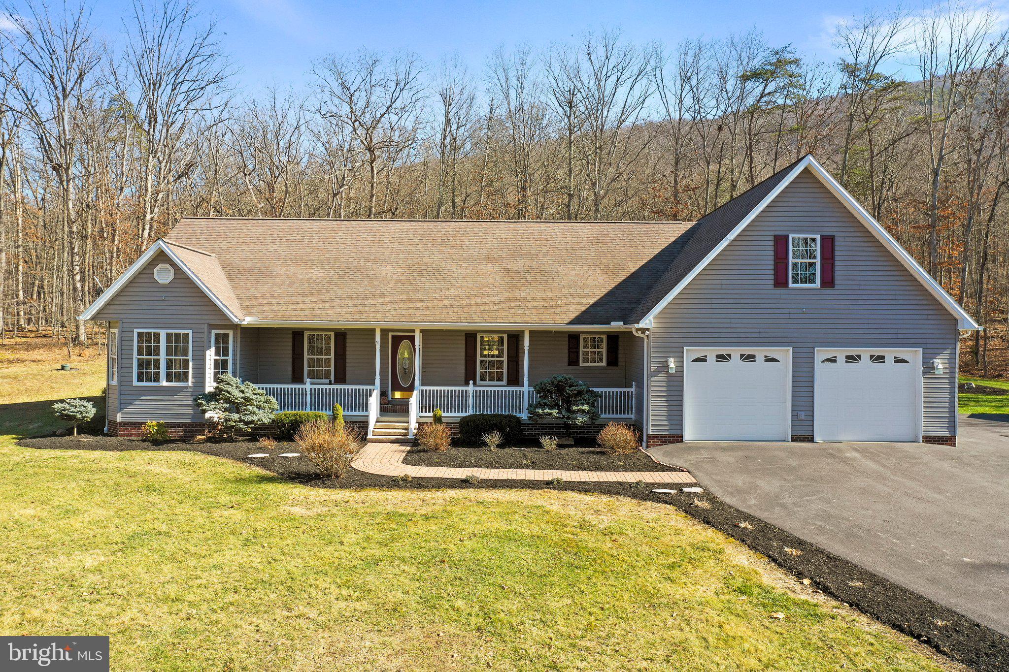 Nestled on over 3.5 acres in the sought after Summit Oaks neighborhood just outside of Moorefield, WV, this stately home offers a perfect blend of sophistication and tranquility.
Step into the heart of the home, where a spacious eat-in kitchen awaits, complete with a walk-in pantry and breakfast bar. The expansive great room boasts vaulted ceilings and a stunning stone fireplace, creating an inviting atmosphere for gatherings.
Beautiful hardwood floors flow throughout, complemented by freshly painted walls and brand-new carpeting. The primary bedroom features a huge walk-in closet and a luxurious jetted soaking tub, providing a serene retreat.
Entertain with ease in the formal dining and living areas or choose from several home office options for remote work. The massive basement offers ample storage and walk-out access to the sprawling grounds. The huge basement offers possibilities for playroom, home theater, gym, and more.  
With a large two-car garage and storage shed, there's plenty of space for all your toys. Outside, enjoy the woodsy setting, complete with a firepit and elegant landscaping, perfect for outdoor relaxation and entertainment.
Experience the epitome of relaxed living in this exquisite home surrounded by nature's beauty, convenient to Moorefield in a coveted neighborhood.  Don’t miss your chance to own 573 Summit Drive!