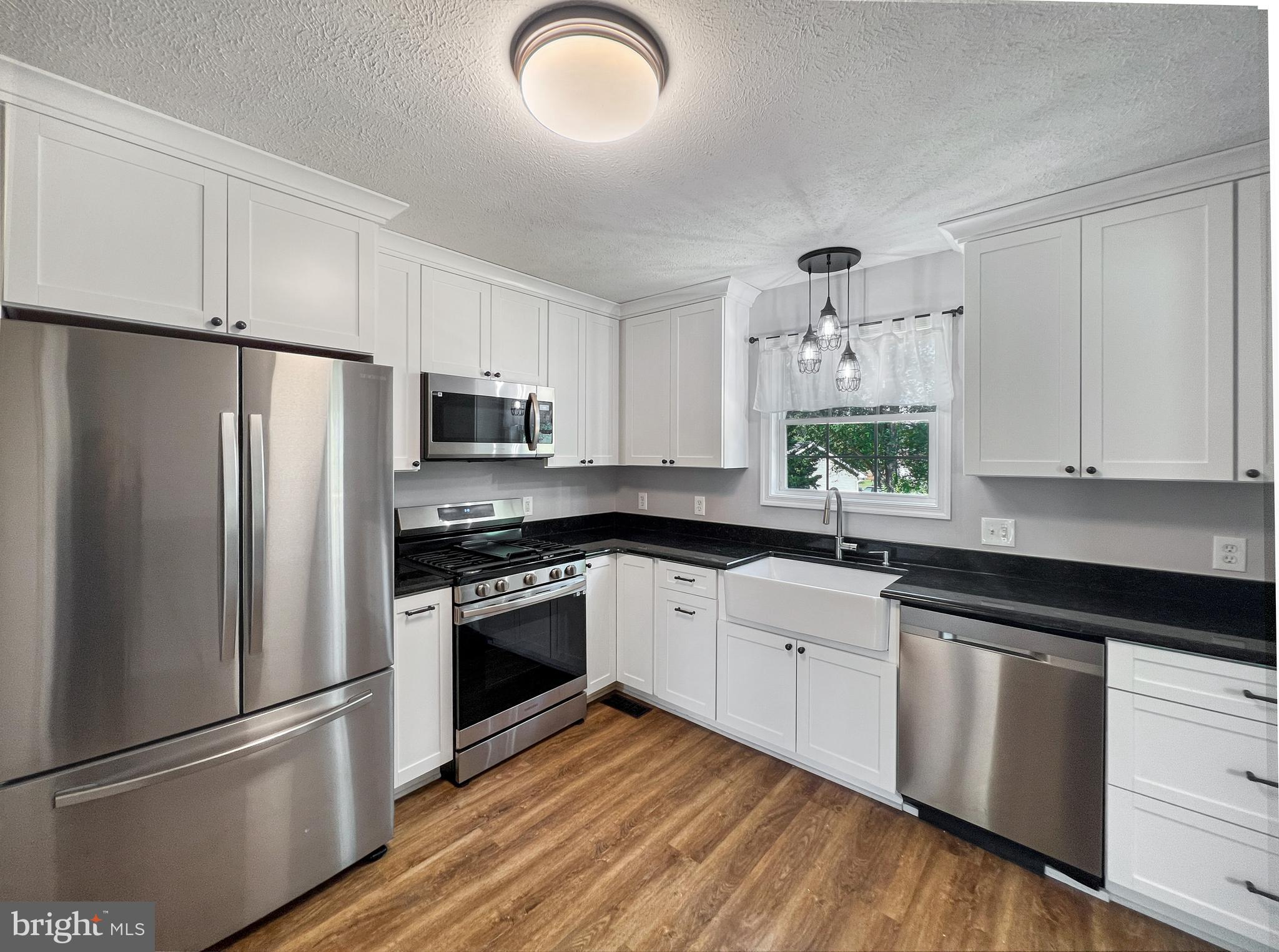This wonderful home is located on a quiet cul-de-sac with a spacious fenced in backyard.  Front porch recently updated. New luxury vinyl plank flooring on the main and lower levels.  Updated kitchen includes granite countertops, white soft close cabinets, stainless steel appliances and ceramic farm sink.  New door from the dining room leads to a new 12x20 deck with stairs to the backyard.  Freshly painted nice sized bedrooms on upper level.  Finished lower level has a door that exits to the backyard as well as a large full bath with dual sinks, separate shower and soaking tub.  Heat is electric until 38 degrees and then switches to propane.  Great commuter location to VA, MD or DC.  Make your appointment today!!