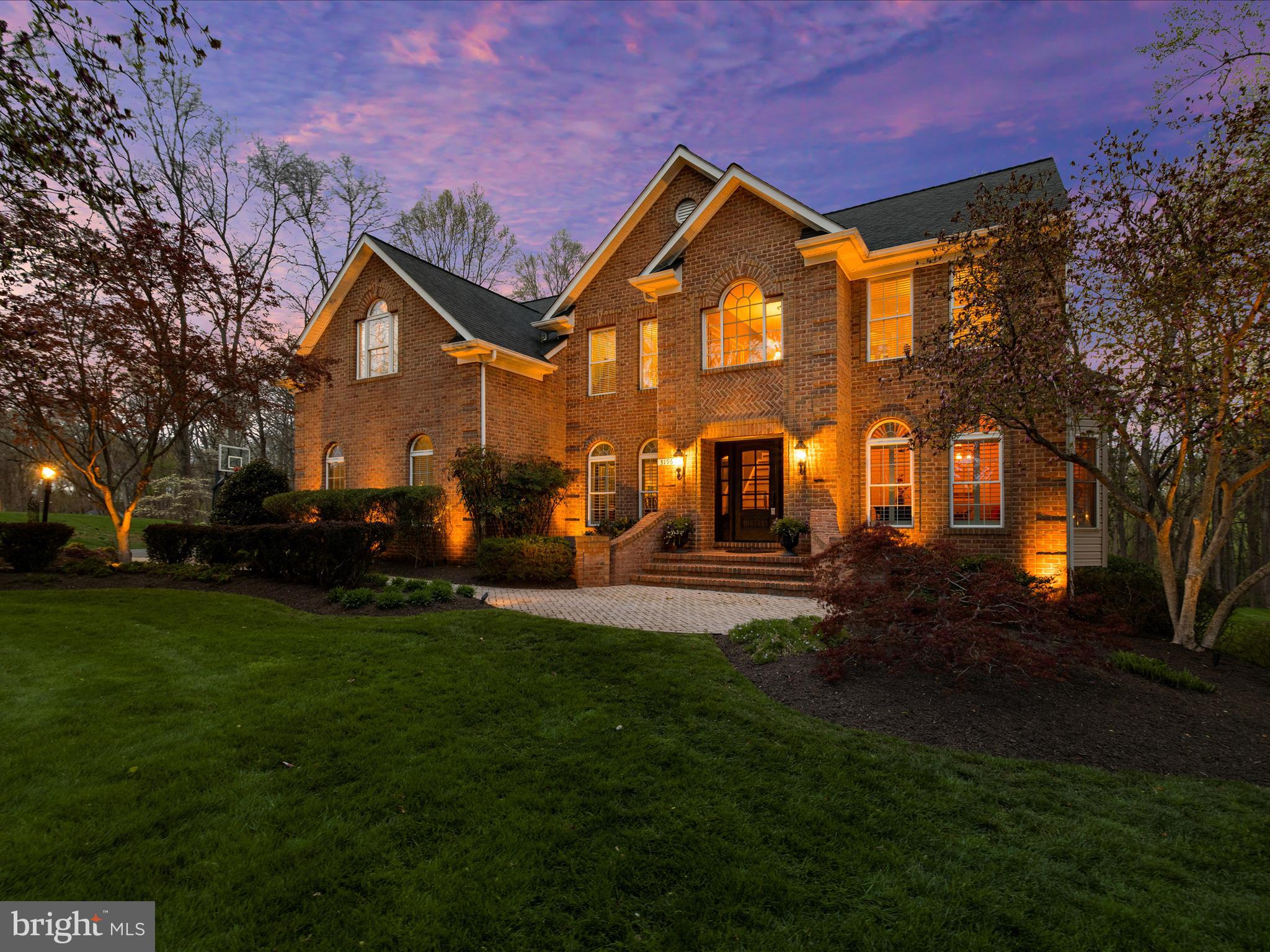 **Offer deadline - Sunday, 4/27/2025 at 6:00 PM. ** Outstanding brick front colonial located on a premium lot in Fox Valley!  From the paver lead walk, extensive landscaping and the upgraded entry door, this home shines with all the right upgrades.  Hardwood flooring, neutral paint and upgraded Kalco lighting throughout provide the perfect backdrop. The stunning, fully remodeled kitchen features white cabinetry, floating shelves, luxurious Quartz countertops, custom backsplash, a large, wood tone island perfect for gathering and upgraded appliances. The adjoining breakfast room leads to a sunroom bathed in natural light with stunning views of the back yard.  Relax in the sunken family room featuring a custom gas fireplace with floor-to-ceiling stacked stone.  The designer wood feature wall is the perfect spot to hang an extra large flat screen TV.  The formal dining room features crown molding, chair rail, a tray ceiling, custom shutters and is a great place to entertain.  The living room with bay window is a versatile space for relaxing and the main level office is great for work from home.  A remodeled laundry room off the garage features additional storage, a sink with quartz countertops and stylish backsplash and a convenient folding station.  Upstairs you will find four bedrooms and two full bathrooms. The primary suite features cathedral ceilings, a sitting area, a large walk-in closet and a spa-like primary bath with natural stone flooring, free-standing tub, double vanities with marble tops and a walk-in shower with frameless door. The walk-out lower level features a large recreation area with a wet-bar, built-ins, gas fireplace and a full bath.  Relax on the low maintenance deck or paver patio overlooking a private and peaceful back yard providing the perfect connection to nature. Extensive landscaping, hardscape, exterior lighting and irrigation make this home shine, day and night! Great community amenities including an outdoor pool and tennis court.  Convenient to commuter routes and top ranked Howard County Public Schools.