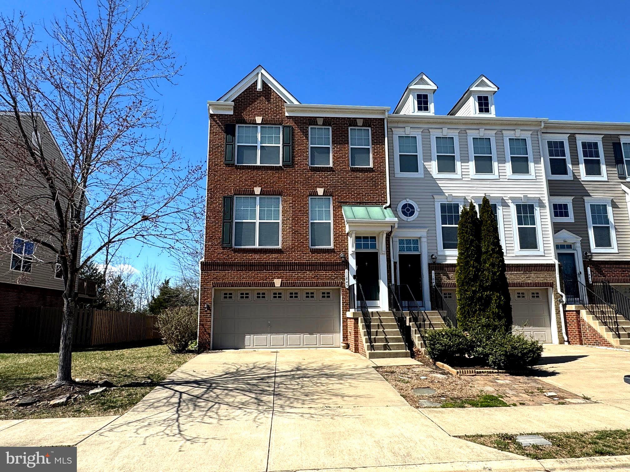 Rarely available, this stunning and bright end-unit townhome with a two-car garage is nestled in the Stillhaven/Dawkins Ridge Community, backing to serene trees with picturesque views. The gourmet kitchen features granite countertops and upgraded cabinetry. Enjoy an inviting open floor plan with wide-plank wood floors, a spacious living room, dining area, and family room on the main level—ideal for entertaining. Step outside to a large deck and a fully fenced backyard with a patio. The luxurious primary suite boasts a dramatic vaulted ceiling, two walk-in closets, and an elegant en-suite bath with dual sinks. The ground-level fourth bedroom offers flexibility as a den, au pair suite, or in-law suite, complete with a full bath.
Conveniently located near walking trails, VRE, I-66 Park & Ride, shopping, and dining. Zoned for Patriot High School. Dogs are considered on a case-by-case basis with a $500 pet deposit per pet. No cats—no exceptions. Minimum income requirement: $130K per year (no more than two incomes to qualify). Excellent credit required. Rental application & credit check required to apply. $35 per applicant for credit check. Click this link to apply.