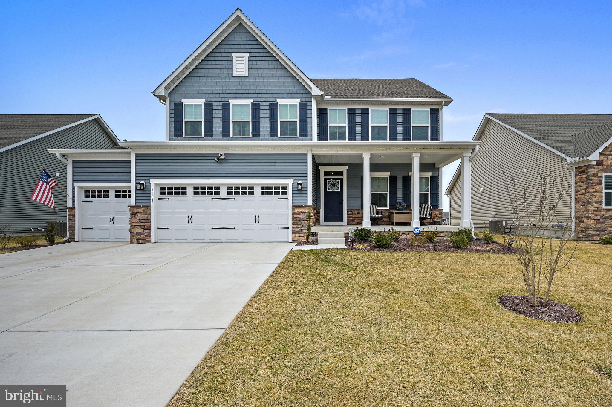 Why wait to build when you can move right into this beautifully upgraded, gently lived-in Greenwood model in the desirable community of Azalea Woods? Pay only half the transfer tax, saving thousands compared to new construction. Perfectly situated backing to a peaceful pond with visiting waterfowl, this home offers a tranquil setting while still being just minutes from Delaware’s coastal attractions.
Inside, the open-concept floor plan features luxury vinyl plank flooring and a warm, inviting living room with a fireplace and granite/quartz surround. The chef’s kitchen is designed for both everyday living and entertaining, complete with an oversized island, under-cabinet lighting, and a sleek slide-in five-burner gas range. The main-level primary suite includes a tray ceiling, spacious en suite bath, and a large walk-in closet with direct access to the laundry room for added convenience.
Upstairs you’ll find three generously sized bedrooms, a full bath, and a versatile loft area perfect for a homework station, gaming space, or additional lounge area. The finished lower level provides even more living space, ideal for movie nights, playroom, or home gym. Outside, a pre-installed gas line is ready for your grill or firepit setup, making it easy to create the perfect outdoor entertaining area. Additional highlights include a security system and a finished, insulated three-car garage with a convenient drop zone entry.
Residents of Azalea Woods will soon enjoy planned resort-style amenities including a pool with lap lanes, pickleball courts, bocce ball, playground, and a clubhouse with fitness space and gathering areas. All of this is just a short drive to Cape Henlopen State Park, historic Lewes, the Rehoboth Beach boardwalk, and outlet shopping. Don’t miss the opportunity to own a nearly new home without the wait or uncertainty of building. Schedule your private showing today.